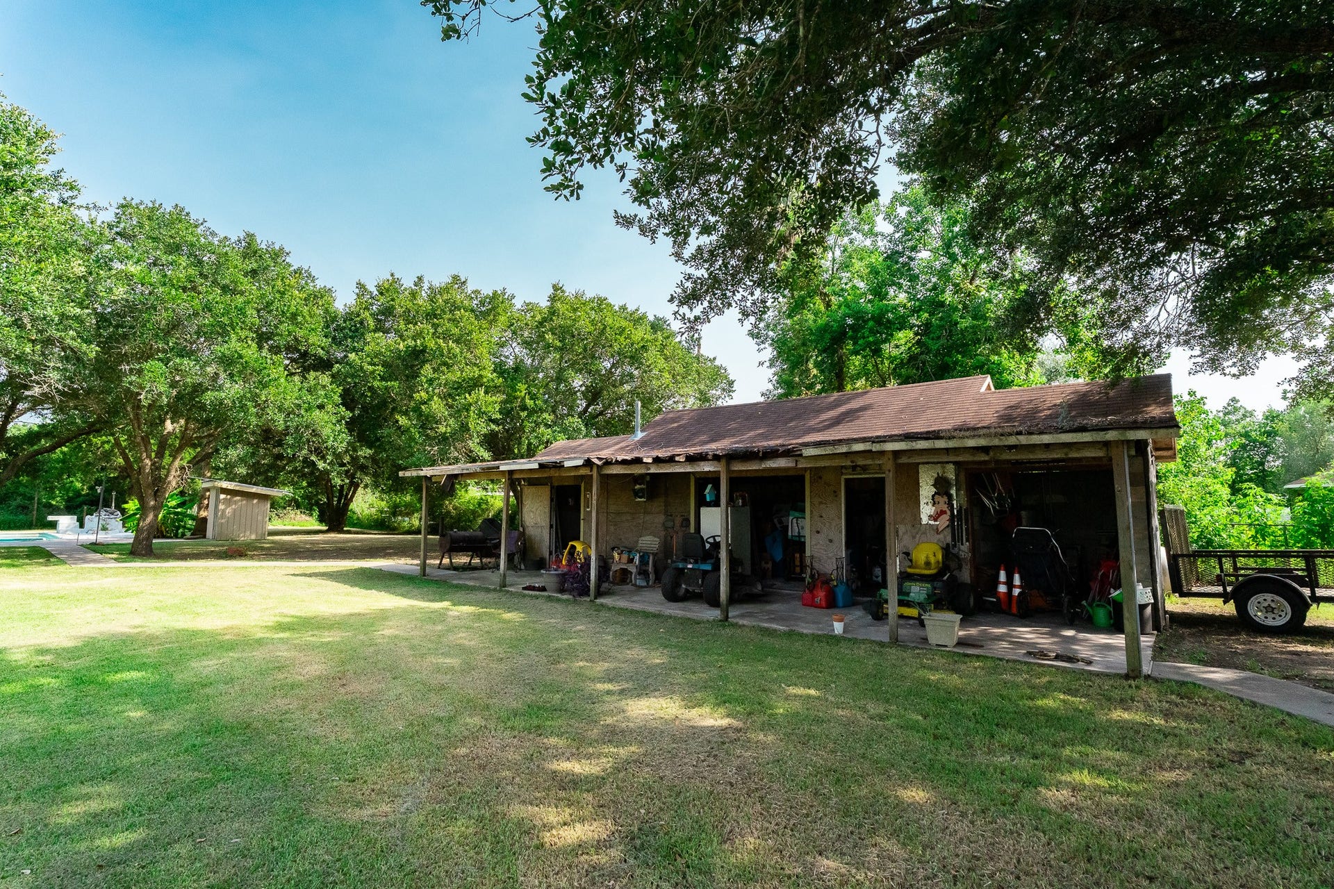 3015 Indian Acres Street, Alvin, TX 77511 Here are the storage sheds/stalls in the back yard... use your imagination on how to use them!