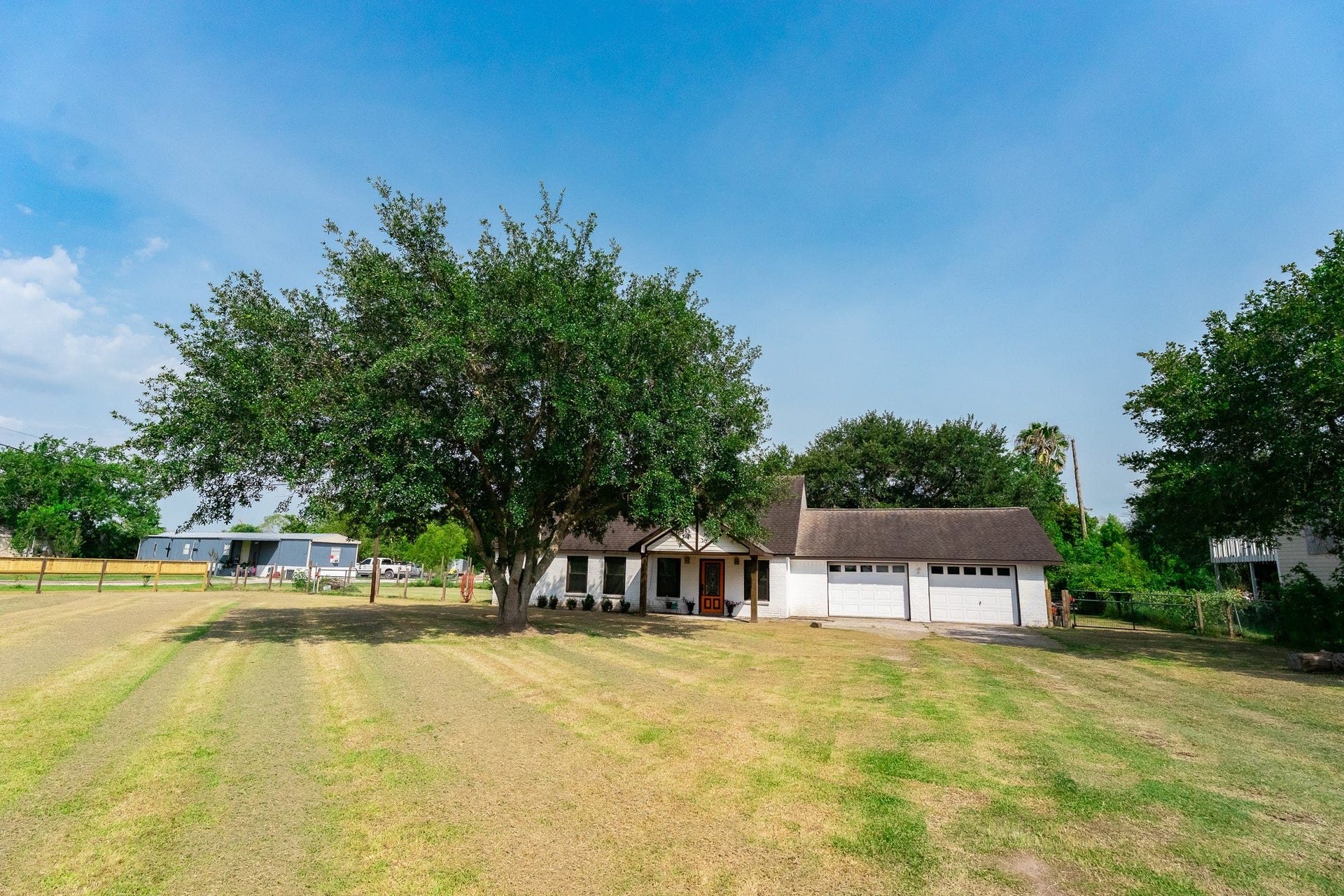 3015 Indian Acres Street, Alvin, TX 77511 View from the street... what a great front yard. Baseball, anyone? Perhaps a bit of golf?