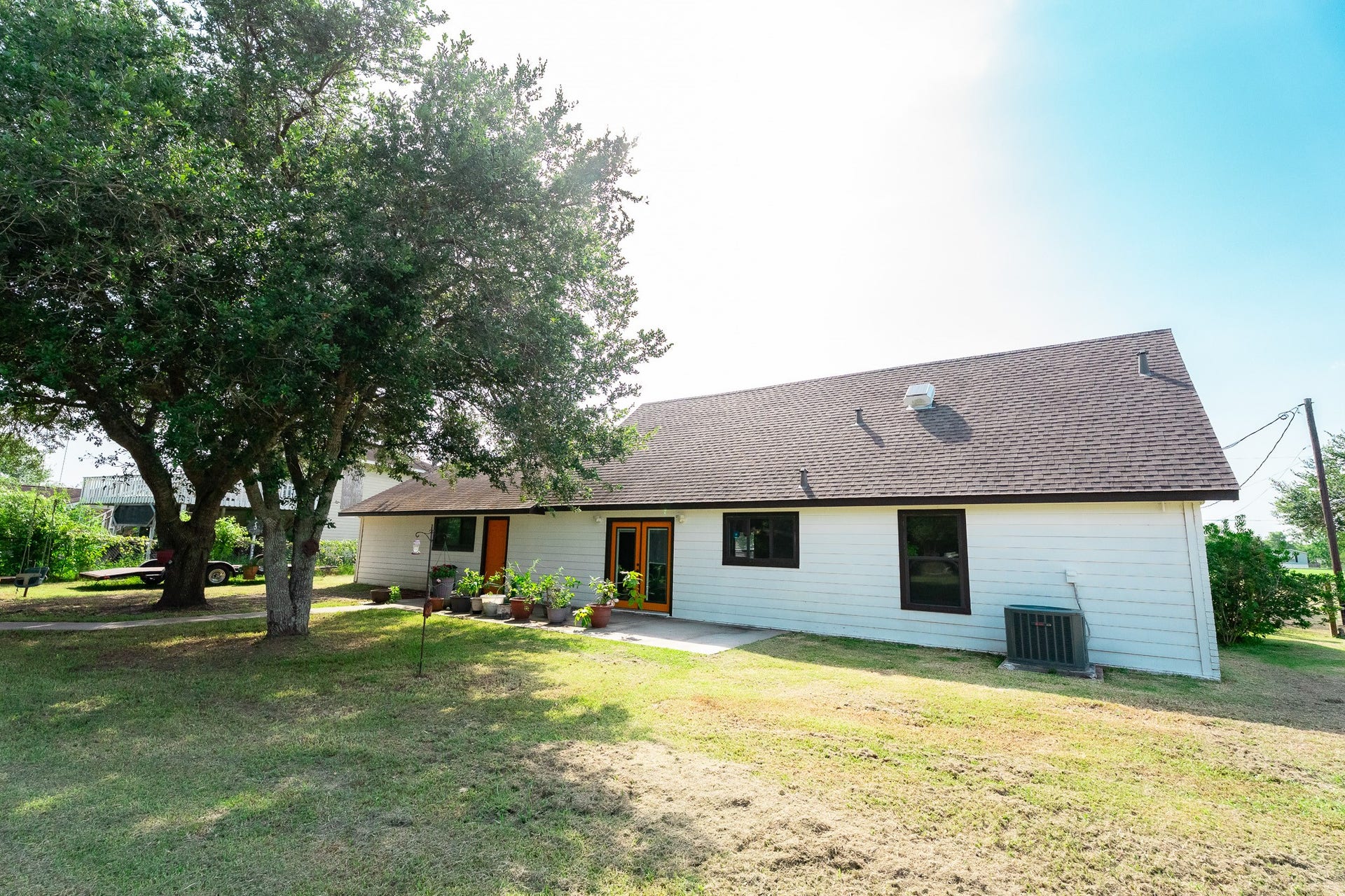 3015 Indian Acres Street, Alvin, TX 77511 A wide shot of the back... remember, it's 1.3 acres... tons of room to play and party!
