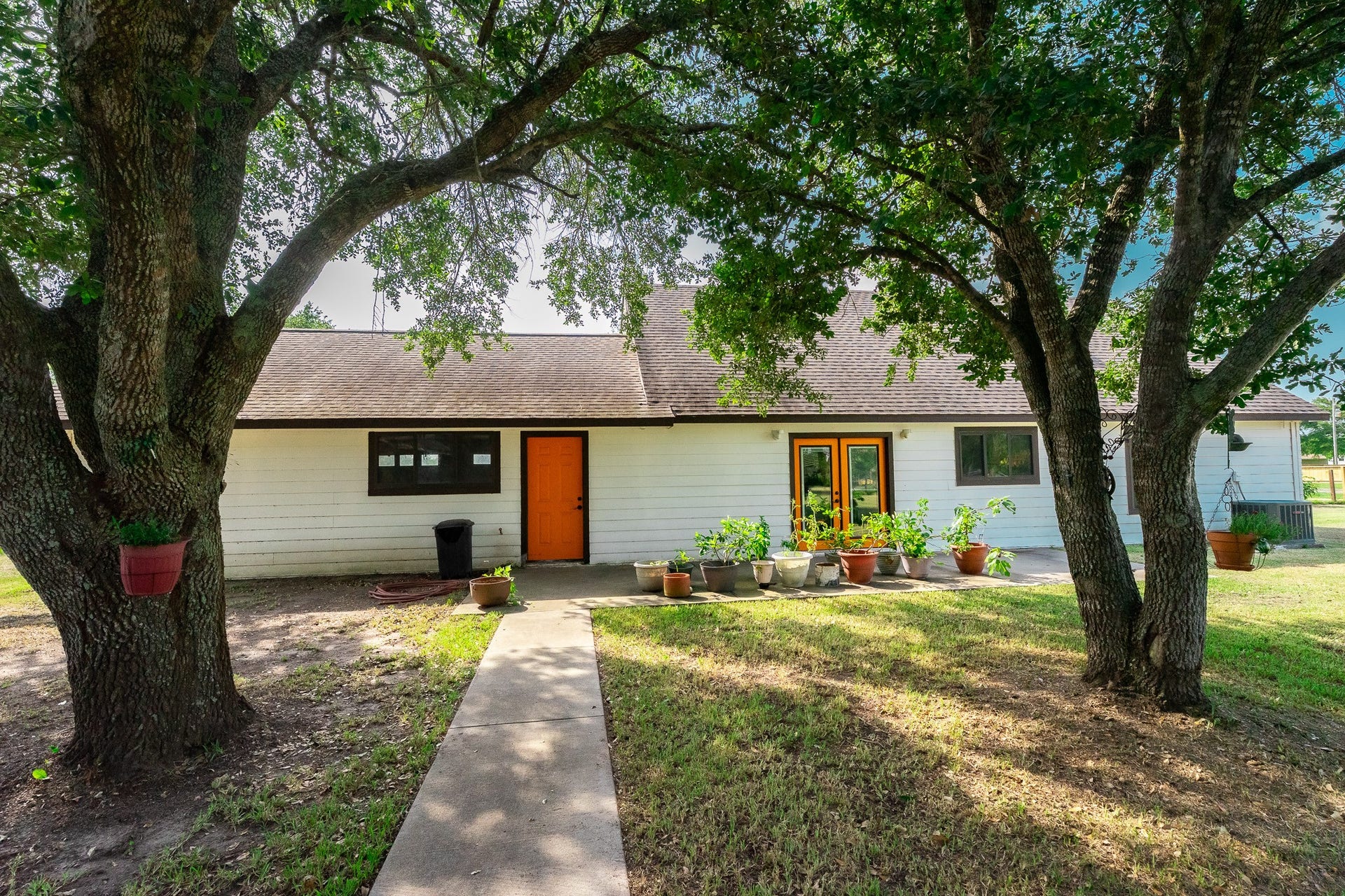 3015 Indian Acres Street, Alvin, TX 77511 Mature trees provide shade for your backyard activities.