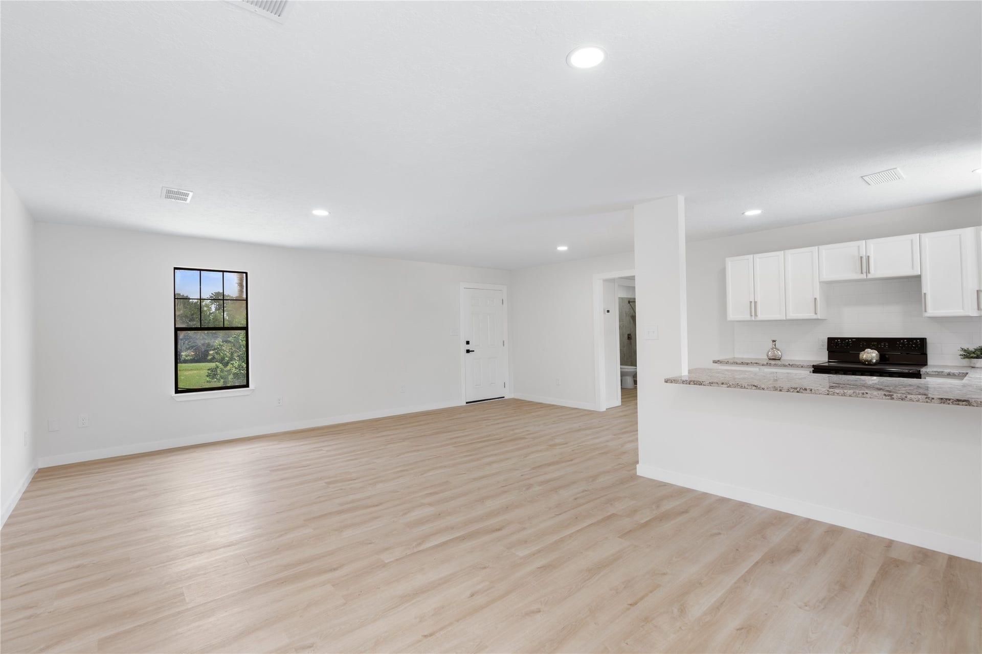 12019 Beth Lane, Magnolia, TX 77354 Separate 800 SF Apartment/Guest house with separate meter if you wanted to rent out for additional income. New Flooring, Fresh Paint, Granite Countertops, Large living area, breakfast bar, new appliances, Full Bath, Spacious bedroom with closet.