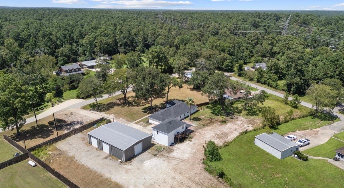 12019 Beth Lane, Magnolia, TX 77354 This is a COMPOUND that has it all and lacks nothing. Multiple living quarters on separate meters is a great opportunity.