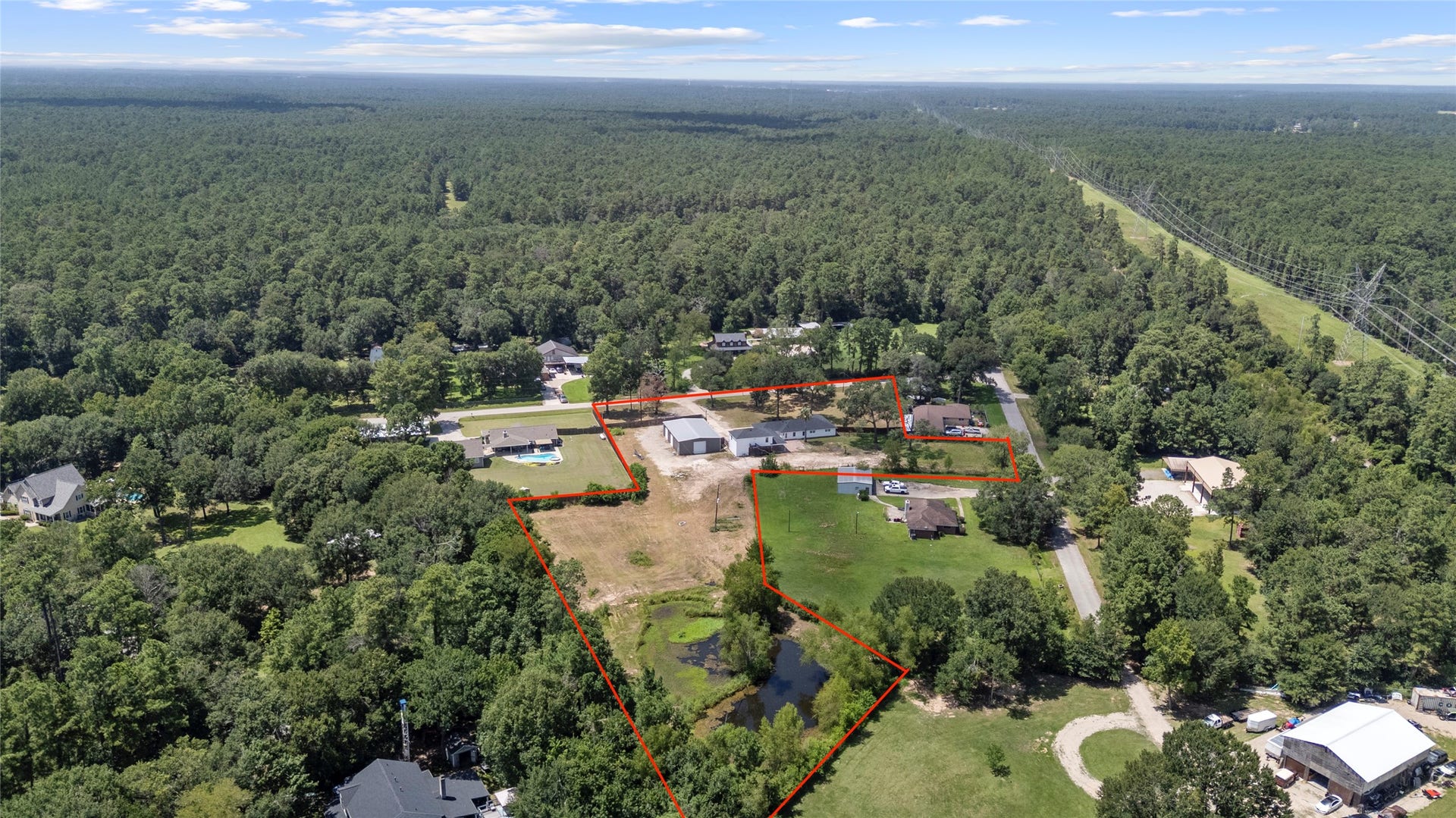 12019 Beth Lane, Magnolia, TX 77354 3.579 Acres with your own stocked pond, 800 sq ft apartment completly redone, and a massive workshop with own gated entrance door.