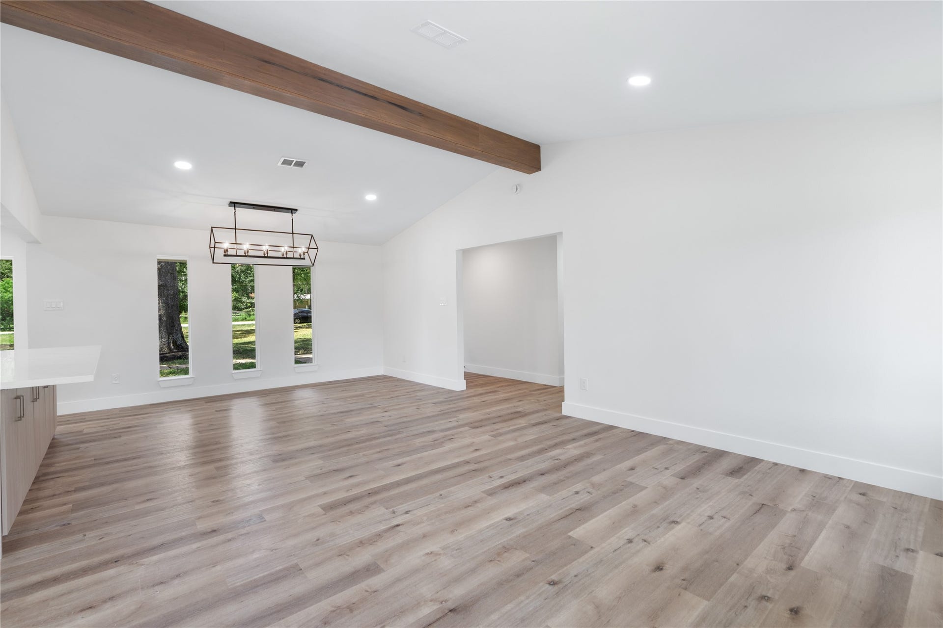 12019 Beth Lane, Magnolia, TX 77354 Another View from this breathtaking expansive great room that highlights the high ceilings and wood beam creating a stiking open atmosphere.