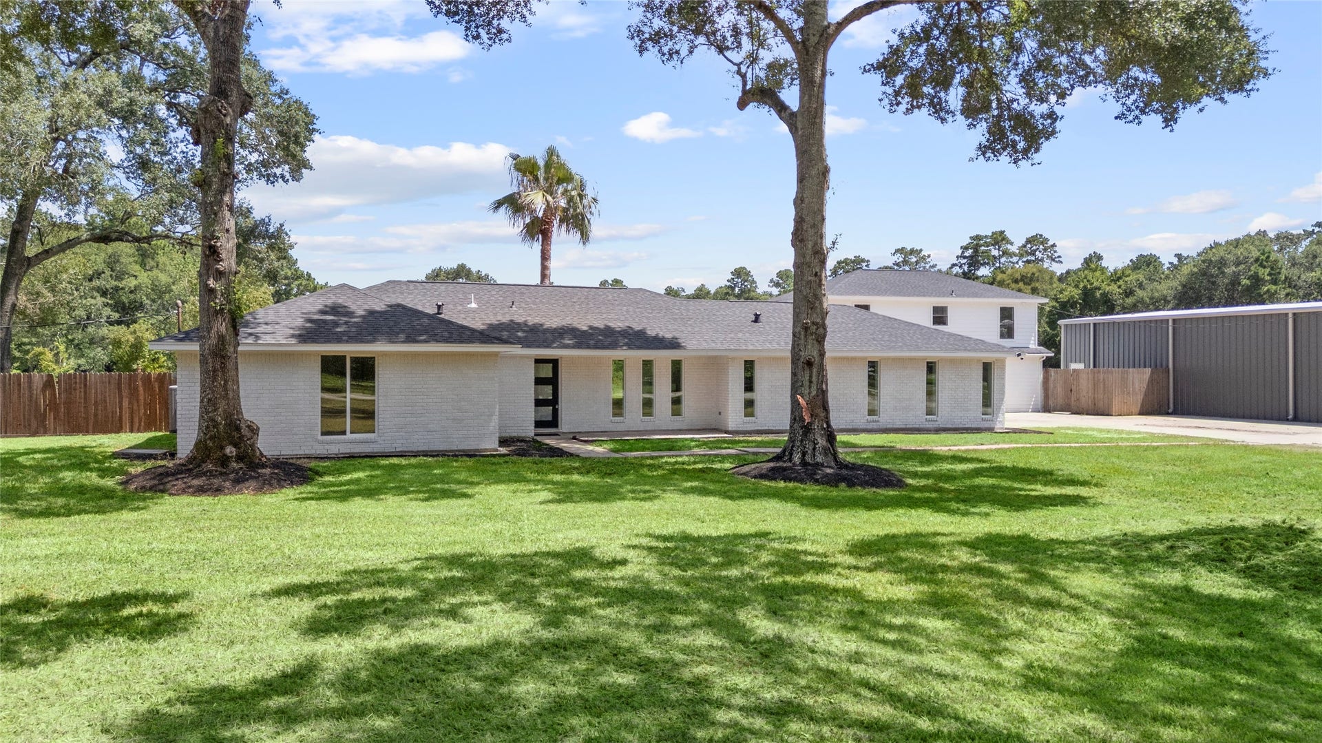 12019 Beth Lane, Magnolia, TX 77354 A RARE find, that has it all From 3.57 Acres of Unrestricted land, to an ADDITIONAL 800 SF in the GUEST/APT, a Fully insulated 60x40 workshop with 3 Bay doors and its own private gated entrance, & a Fully stocked Private Pond that sits at the back of the property for Fishing- all from your private sanctuary.