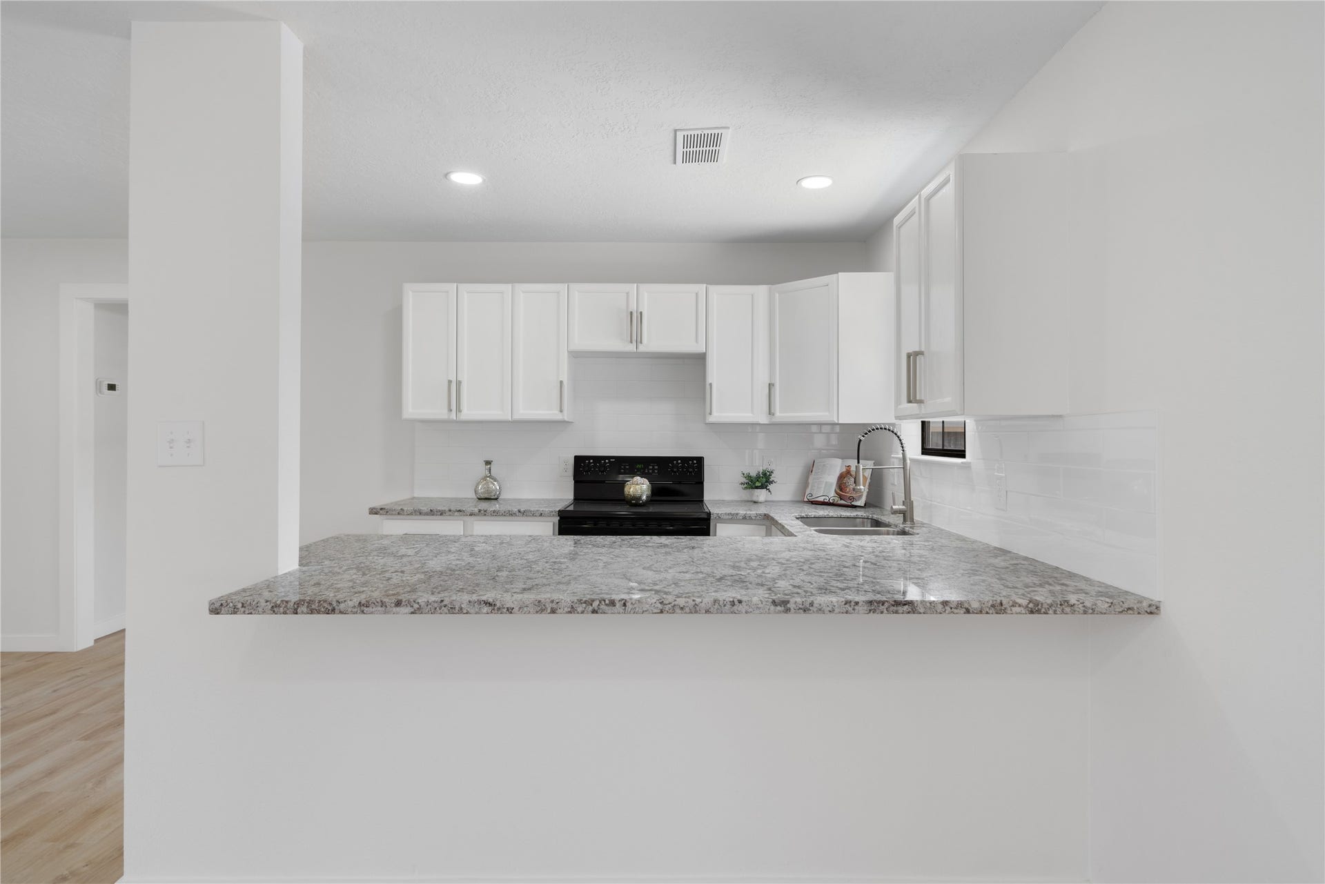 12019 Beth Lane, Magnolia, TX 77354 Apartment- Breakfast bar, new stovetop, granite countertops, modern hardware, led lighting.