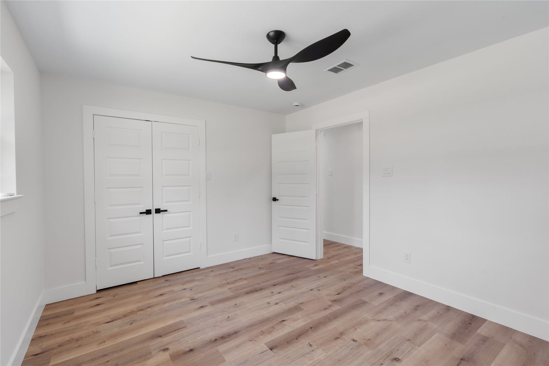 12019 Beth Lane, Magnolia, TX 77354 Spacious Bedroom 1- 5 panel doors, modern fan, no carpet.