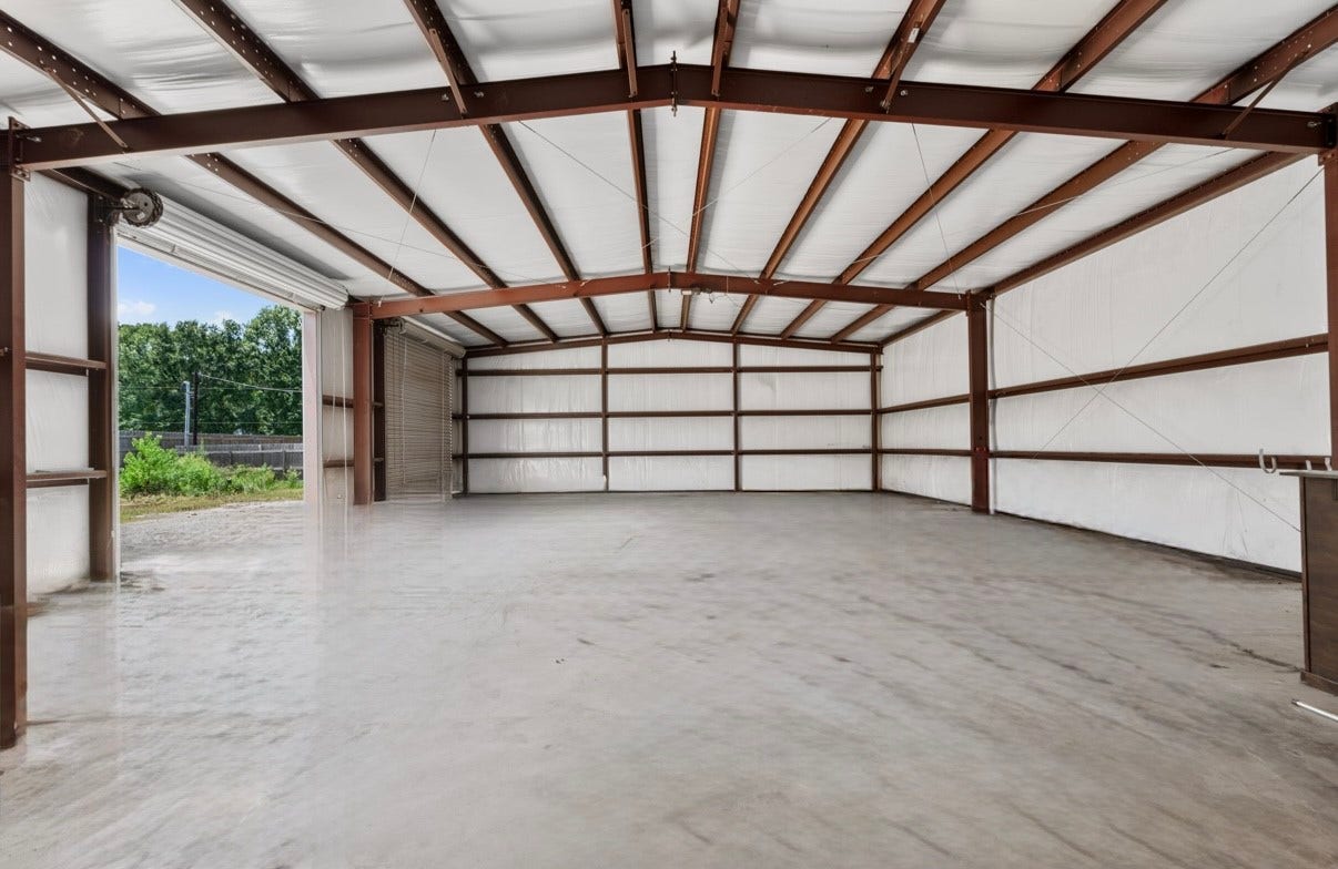 12019 Beth Lane, Magnolia, TX 77354 Run your business from your home or create the ultimate man cave, Fully insulated, Steel Building, 60x40, 3 (12x12) Bay Doors, Has its own seperate entrance gate.