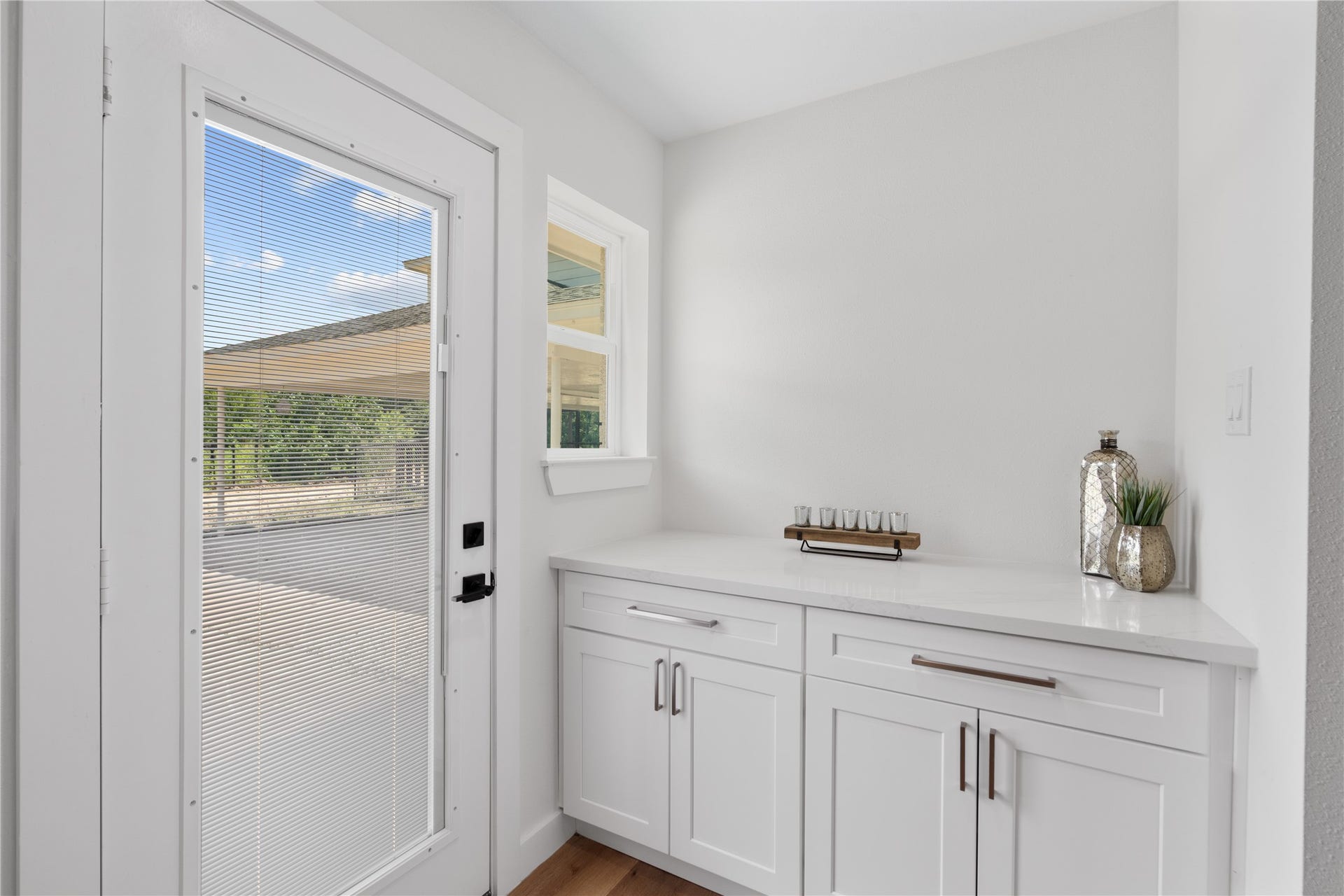 12019 Beth Lane, Magnolia, TX 77354 Tucked away in the back of the kitchen is the open butler pantry area with shelving on the opposite side for groceries, and additional storage, also makes a great space for a coffee bar or serving area.