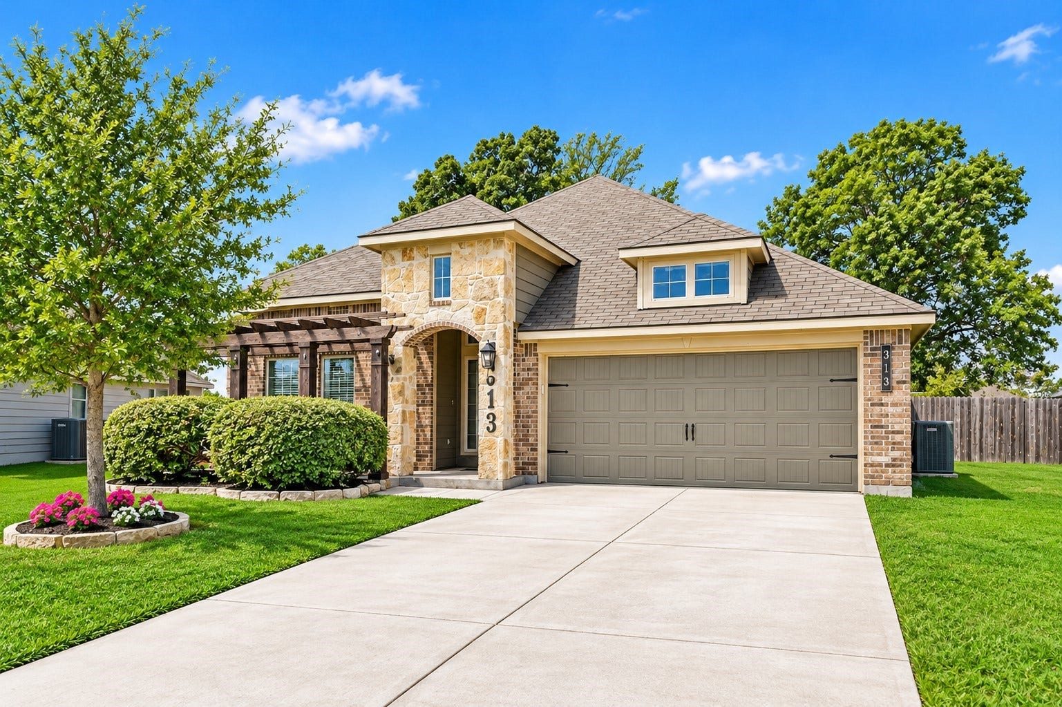 313 Brocks Court, Montgomery, TX 77356 Double wide driveway for plentiful parking and through that right fence is a gate to store trailers and more!