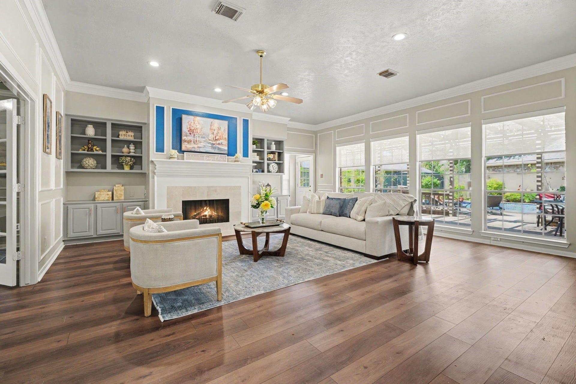 16507 Heather Meadow Court, Pasadena, TX 77059 This spacious living room features a warm, inviting atmosphere anchored by a cozy gas-log fireplace. Adjacent to the living area, you will find a conveniently located home office, while elegant box molding throughout adds architecture, depth & an upscale fell.