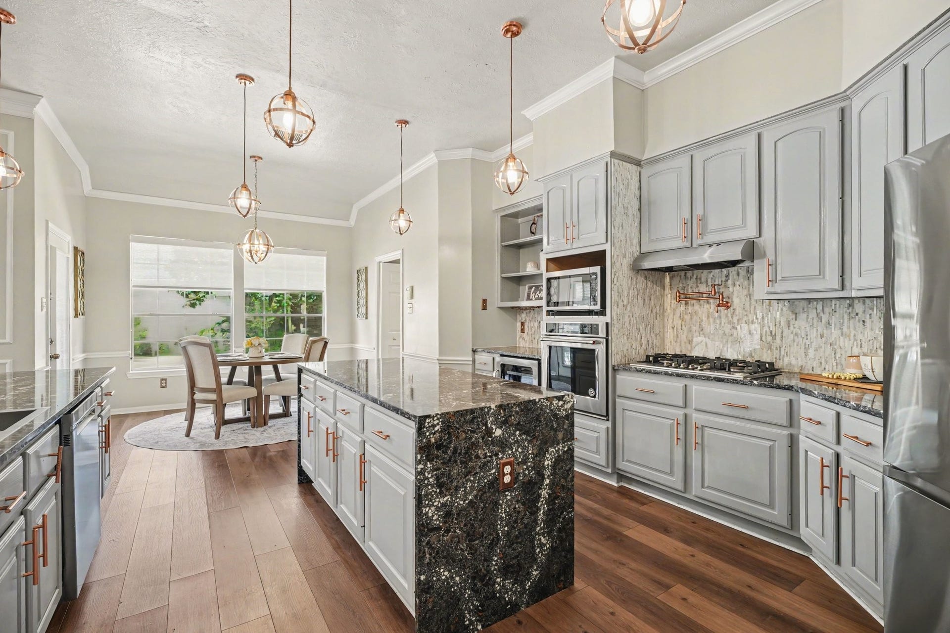 16507 Heather Meadow Court, Pasadena, TX 77059 Thoughtful details were included that make this kitchend both functual, aesthiecal pleasing from the copper accent cabinet pulls to the pot filler to the amount of storage you will have.