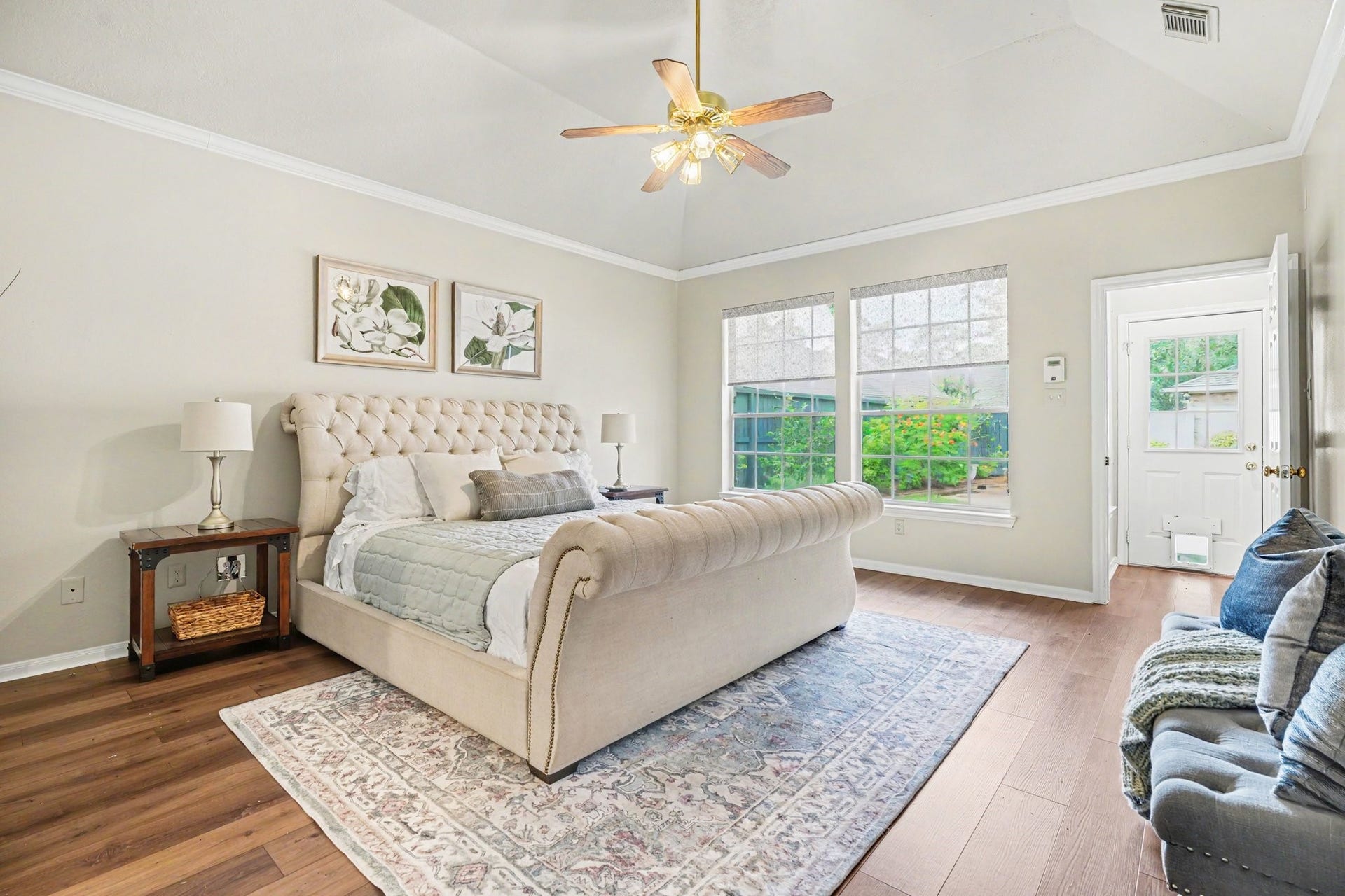 16507 Heather Meadow Court, Pasadena, TX 77059 This is a view of the primary suite taken from the primary bathroom entryway, highlighting the natural light and the serene backyard view of the pool and patio.