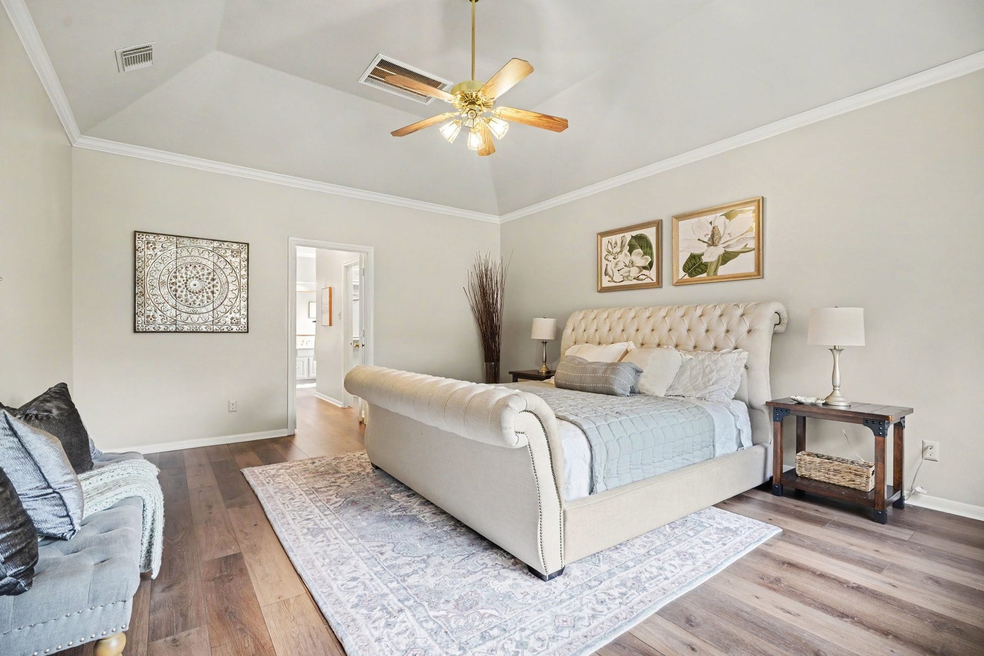 16507 Heather Meadow Court, Pasadena, TX 77059 This home features a stunning vaulted ceiling that angles upward toward a central peak, creating a sense of height, volume, and openness. The design utilizes a sophisticated multi-sided hip architecture, which slopes upward from all four walls to add depth and architectural character to the room.