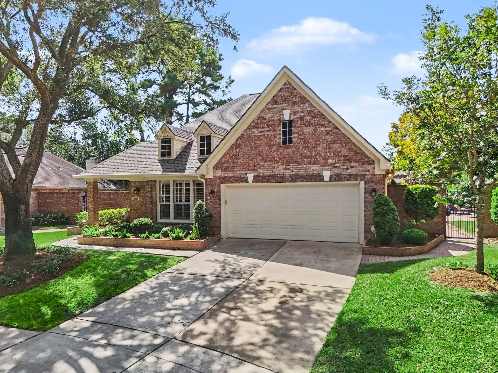 16507 Heather Meadow Court, Pasadena, TX 77059 Mature trees provide welcome shade and a beautiful natural backdrop, complemented by established landscaping that enhances the home's curb appeal and creates a warm, inviting first impression.