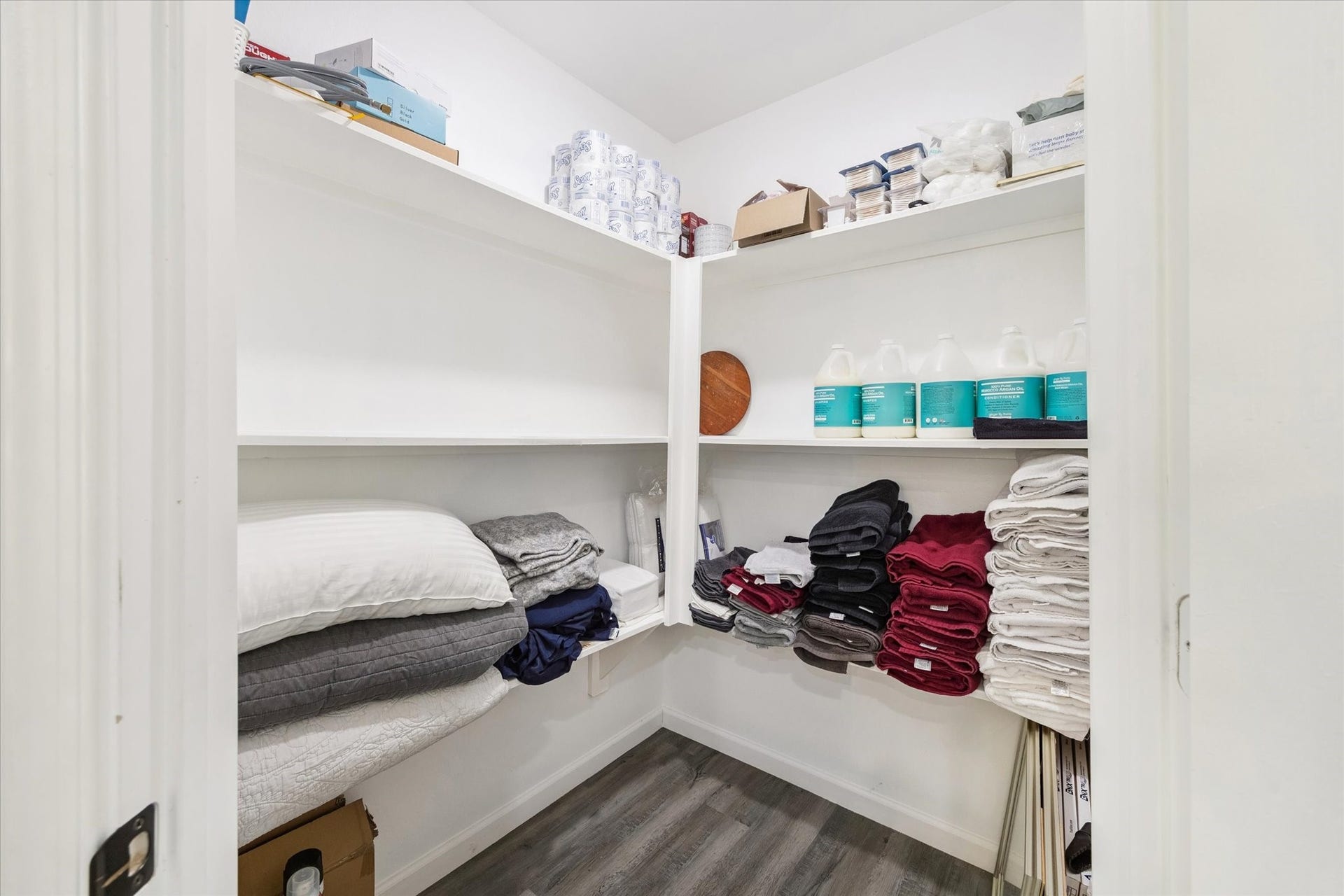 A spacious walk-in pantry offers plenty of shelving and storage, keeping the kitchen organized and clutter-free. Its size makes it perfect for bulk storage and easy access to everyday essentials.