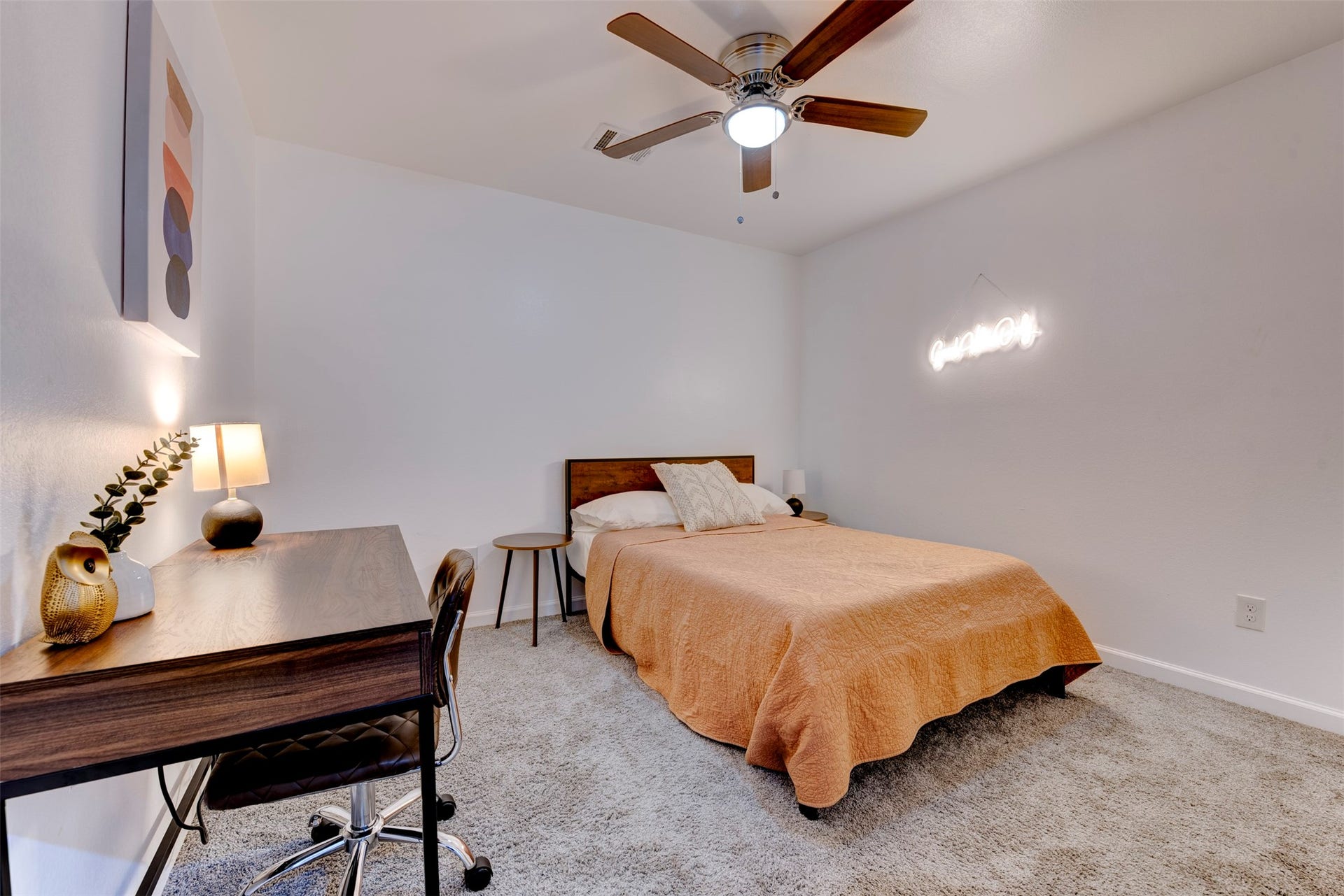 A third secondary bedroom offers enough space for a desk or reading nook. Complete with a ceiling fan and light kit, its a comfortable and flexible space.