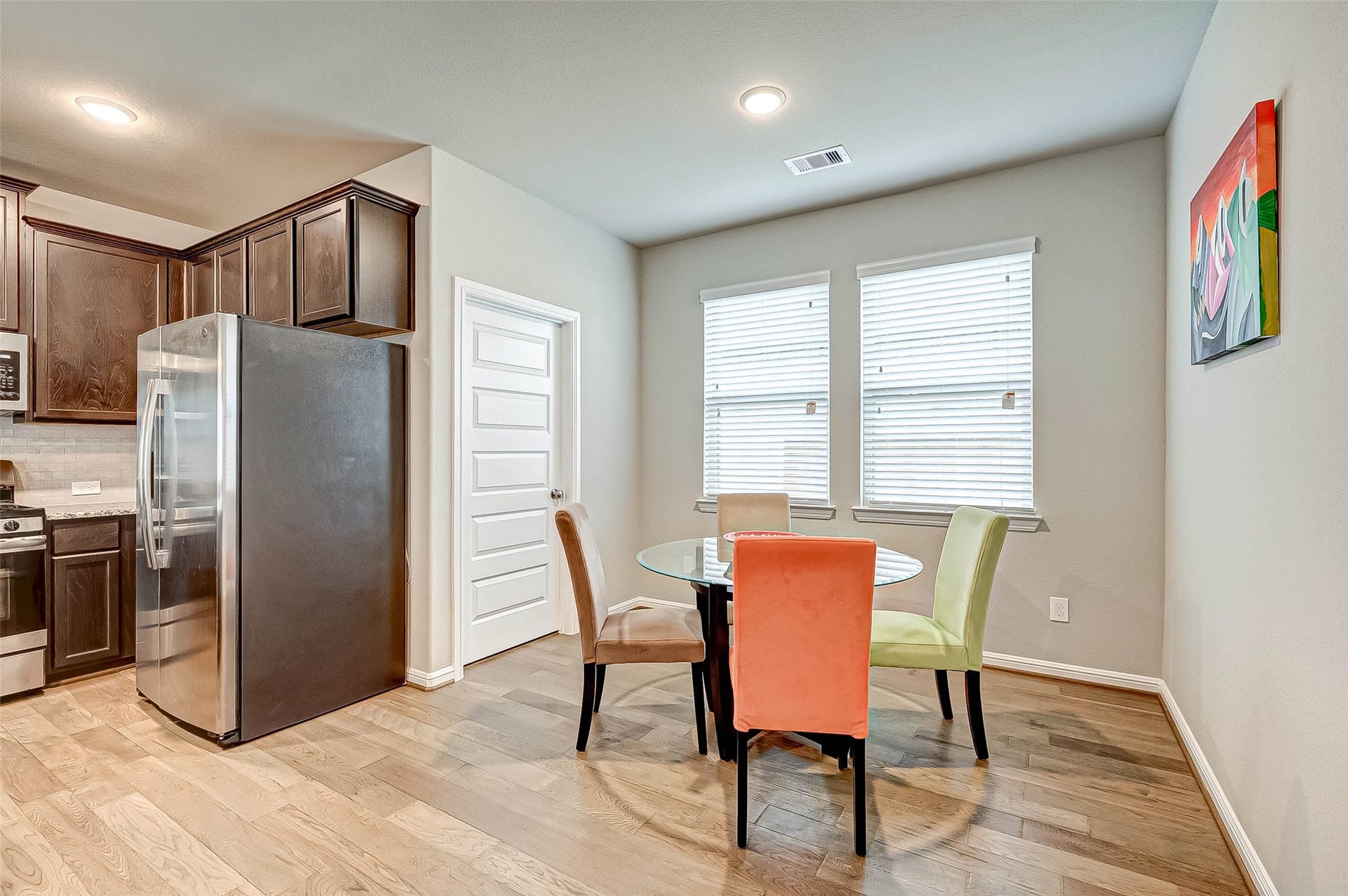 7914 Euphonia Glade Lane, Richmond, TX 77407 Open kitchen and dining arrangement makes everyday meals and entertaining easy.
