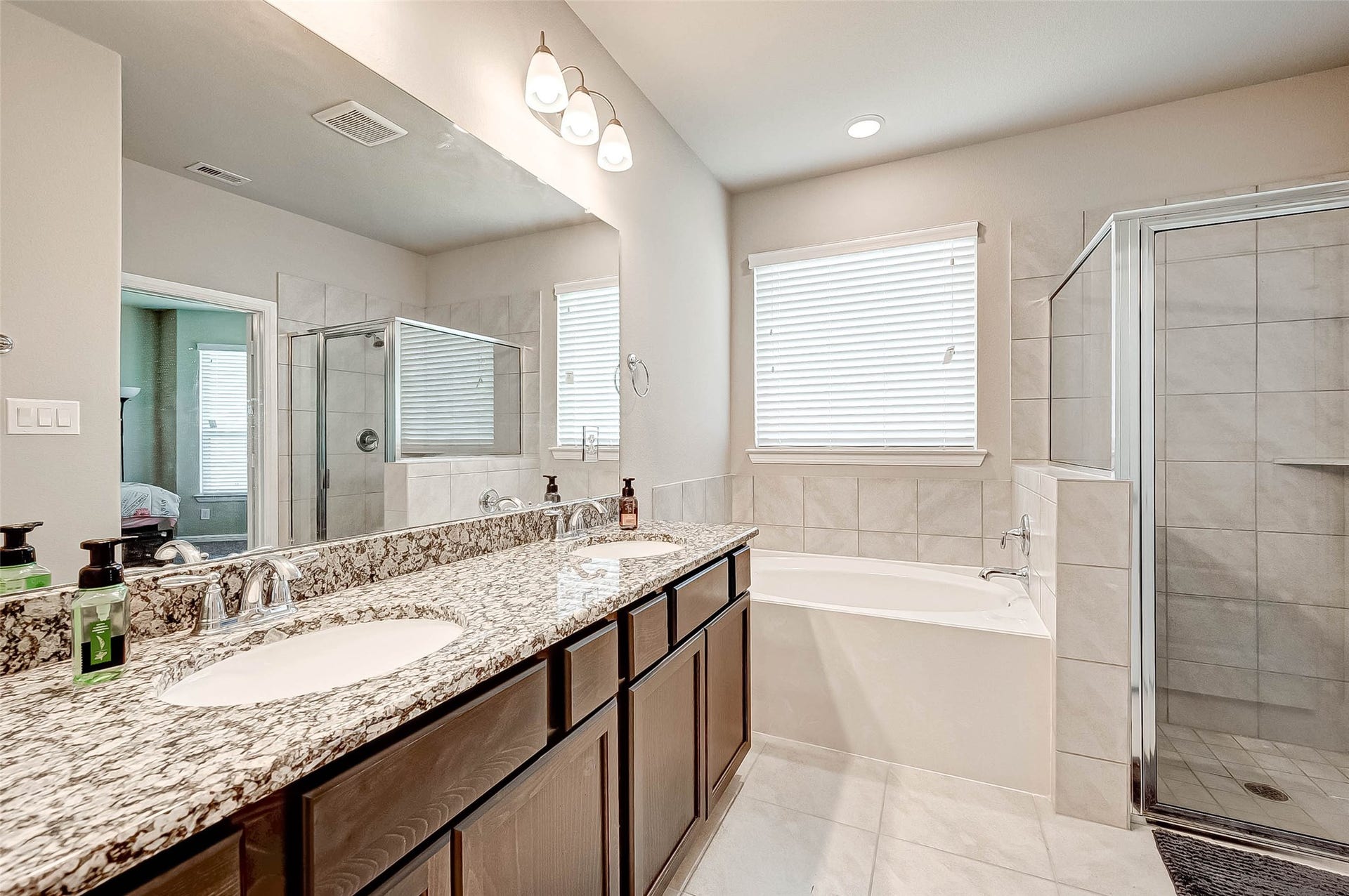 7914 Euphonia Glade Lane, Richmond, TX 77407 Private primary bath features double sinks, ample vanity space, and a separate shower.