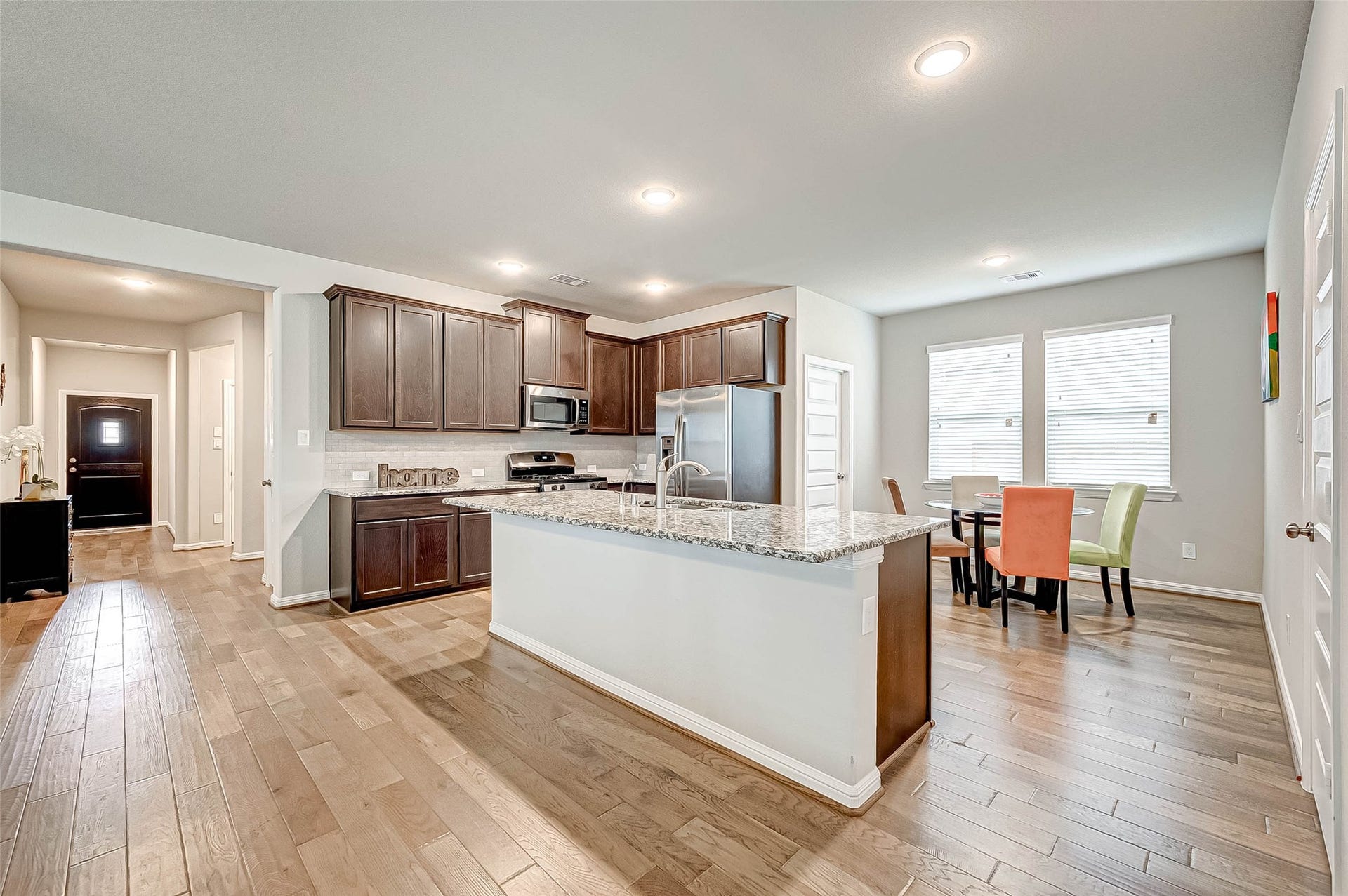 7914 Euphonia Glade Lane, Richmond, TX 77407 Functional kitchen features granite countertops, generous cabinetry, built-in appliances, and ample prep space.