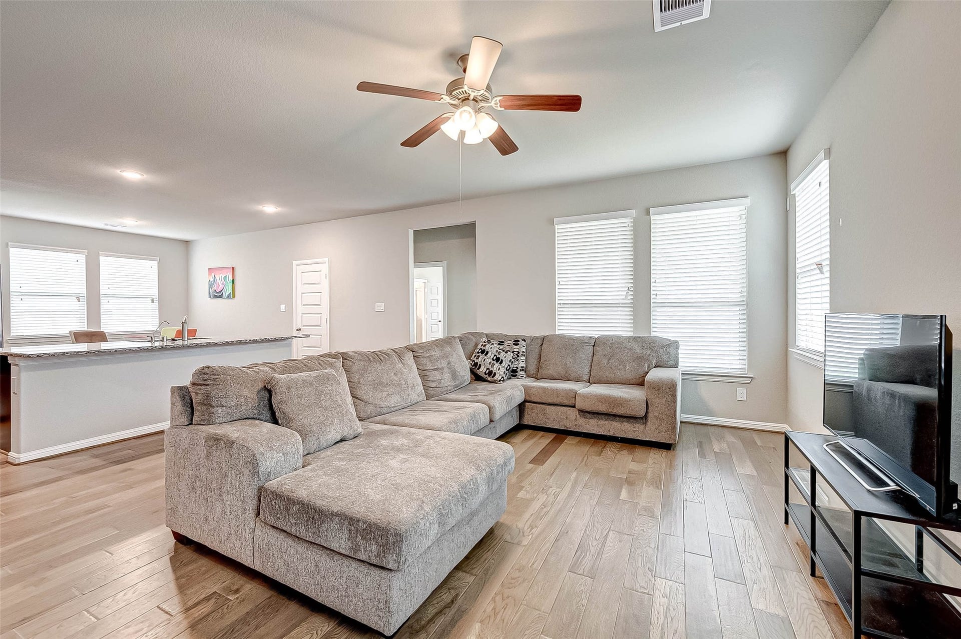 7914 Euphonia Glade Lane, Richmond, TX 77407 Spacious family room offers plenty of room for comfortable everyday living and entertaining.