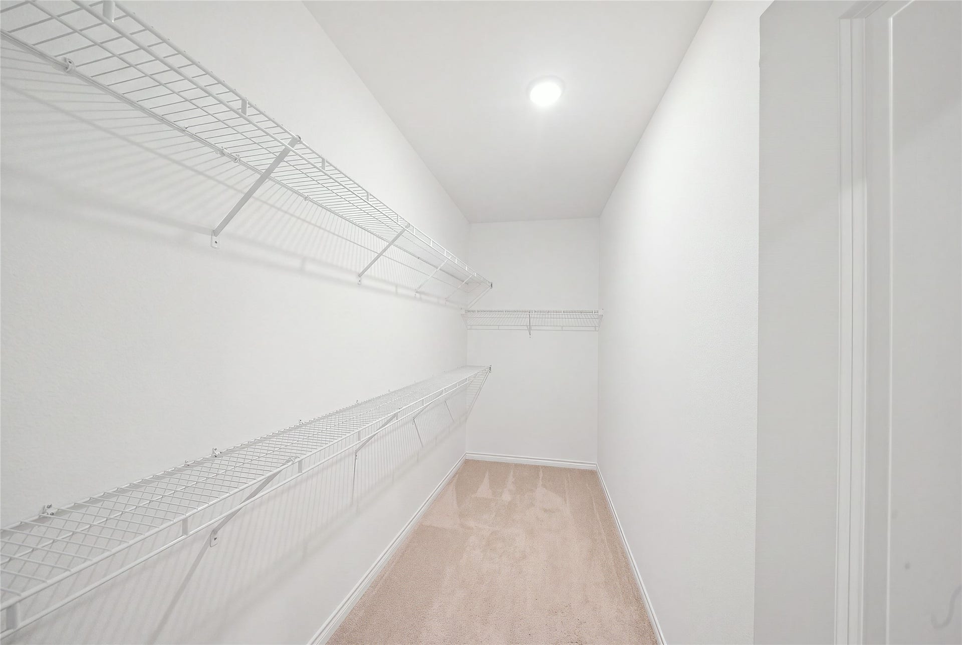 15194 Wild Gully Way, Conroe, TX 77302 Spacious primary walk-in closet with ample storage and room to stay organized