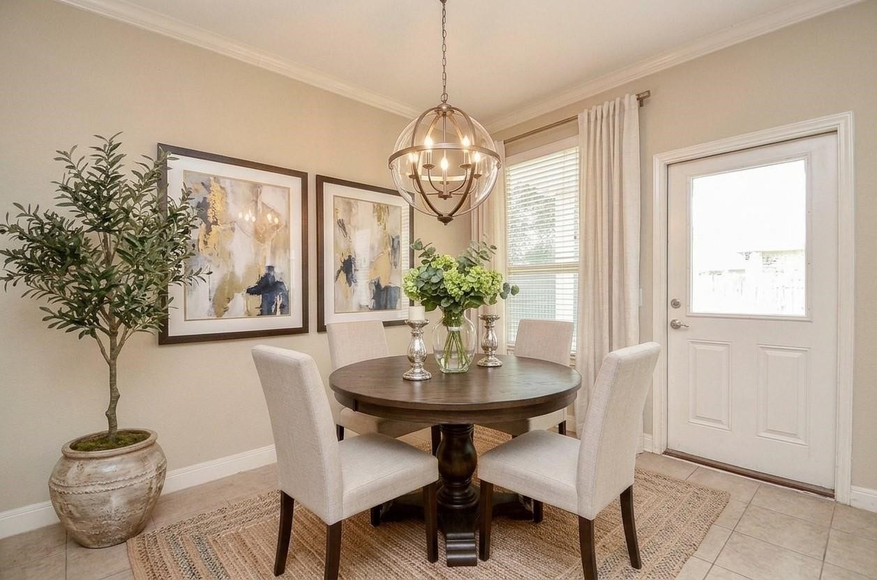 1215 Majestic Oak, Richmond, TX 77469 Dining room with virtual staging and virtual updated light
