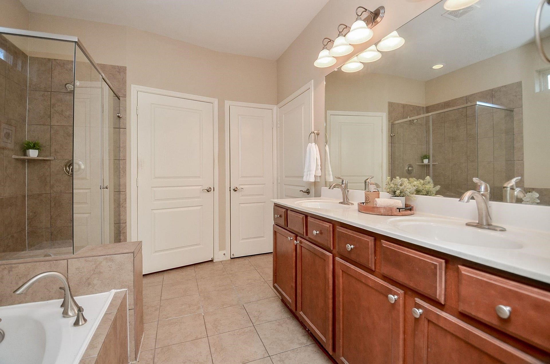 1215 Majestic Oak, Richmond, TX 77469 Large Bathroom Ensuite with Oversized double vanity, soaking tub, and Large Shower