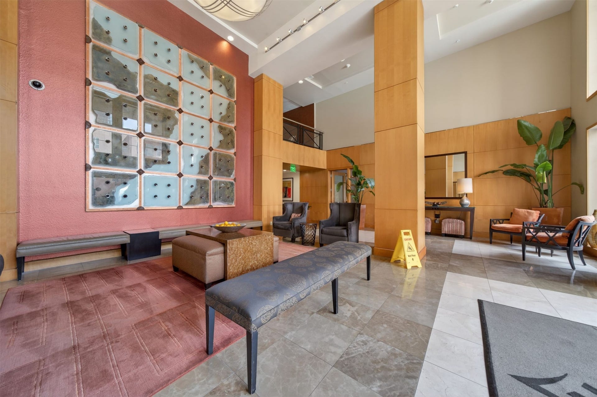 3505 Sage Road, #314, Houston, TX 77056 Spacious and elegant lobby featuring modern art, comfortable seating, and abundant natural light, creating a welcoming atmosphere.