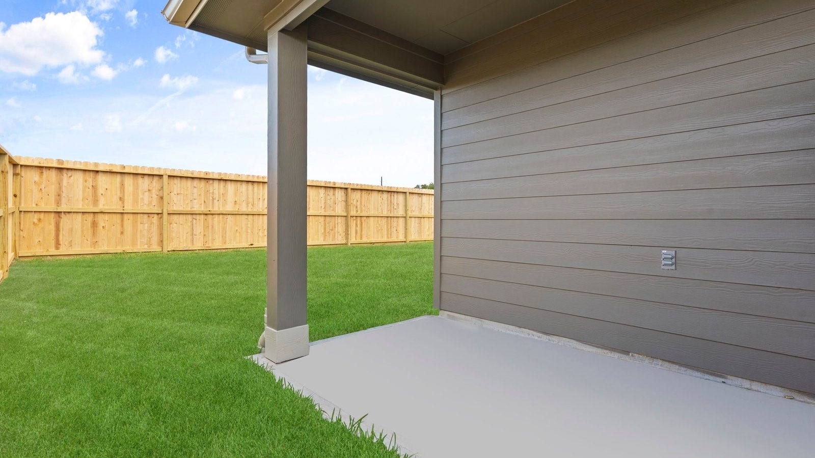 3505 Horseshoe Trail Road, League City, TX 77511 Outdoor covered patio with seating area overlooking a well-maintained lawn, perfect for relaxation.