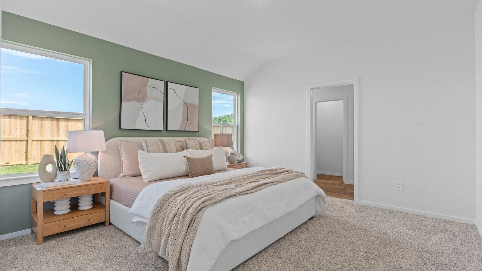 3505 Horseshoe Trail Road, League City, TX 77511 A spacious primary bedroom emphasizing open space and natural lighting with large windows.