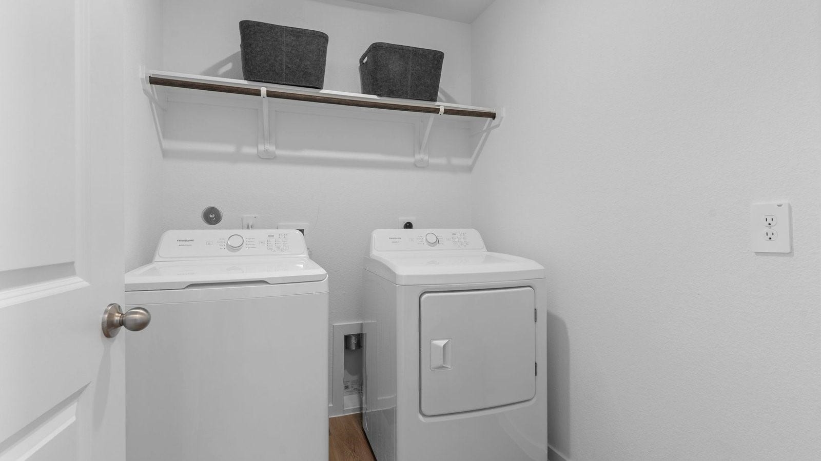 3505 Horseshoe Trail Road, League City, TX 77511 Spacious laundry room with washer and dryer connections, hanging rod, and vinyl wood flooring