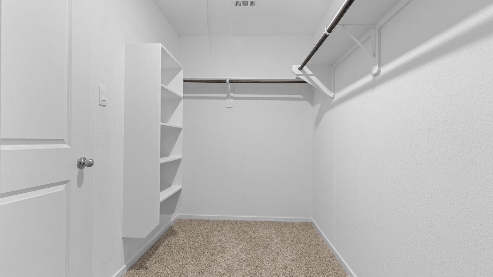 3505 Horseshoe Trail Road, League City, TX 77511 A spacious walk-in closet off the primary bathroom with multiple hanging rods, and shelves for maximum storage capabilities.