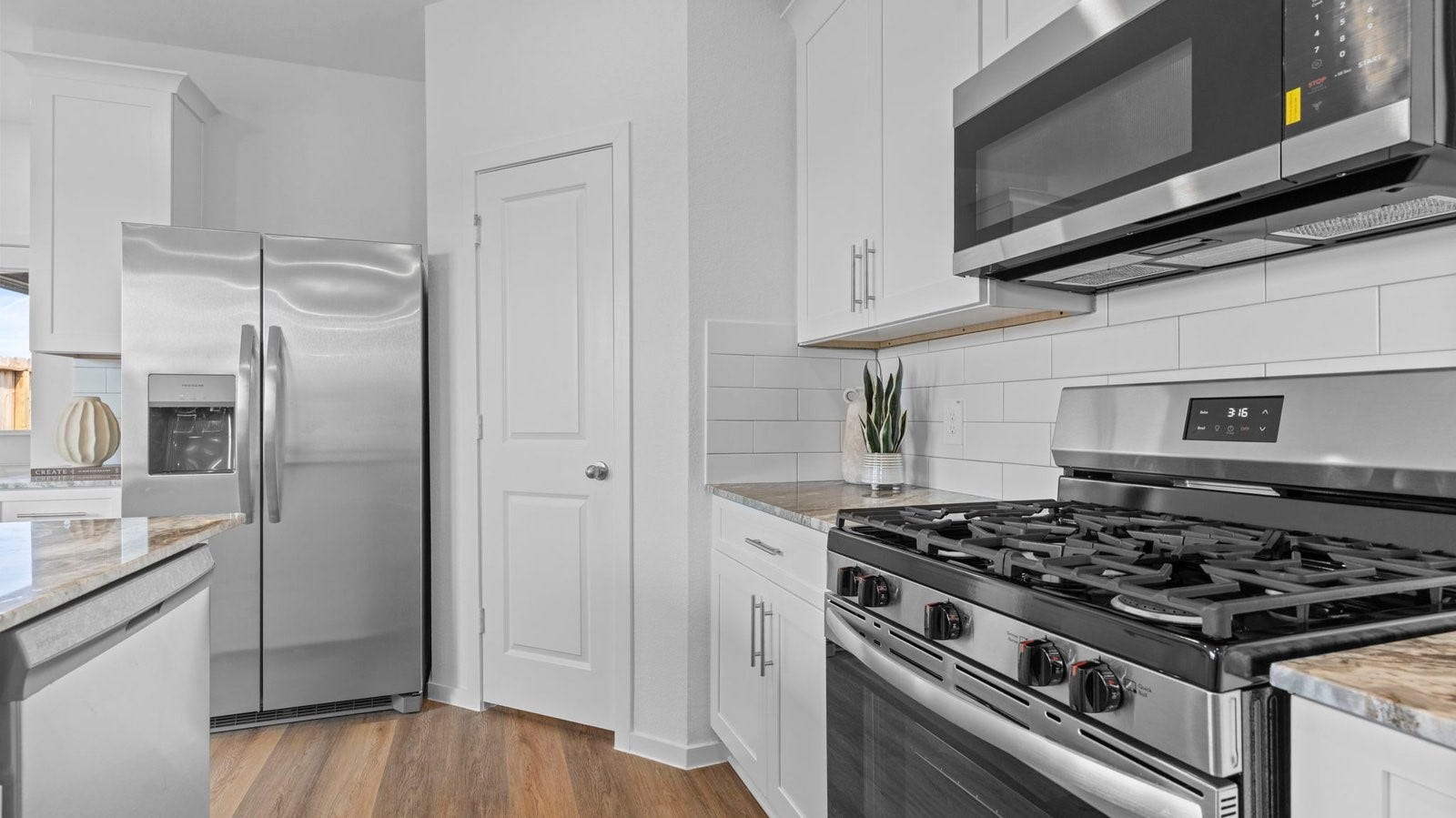 3505 Horseshoe Trail Road, League City, TX 77511 Kitchen adorned with painted cabinets seamlessly integrated into an open dining area layout.