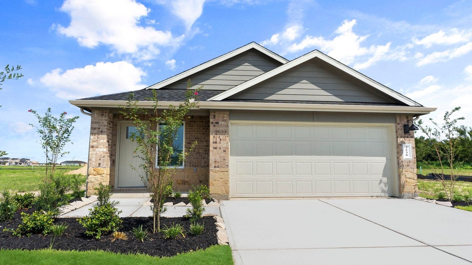 3505 Horseshoe Trail Road, League City, TX 77511 Newly built single story home with traditional architecture, a garage, and landscaped front yard.