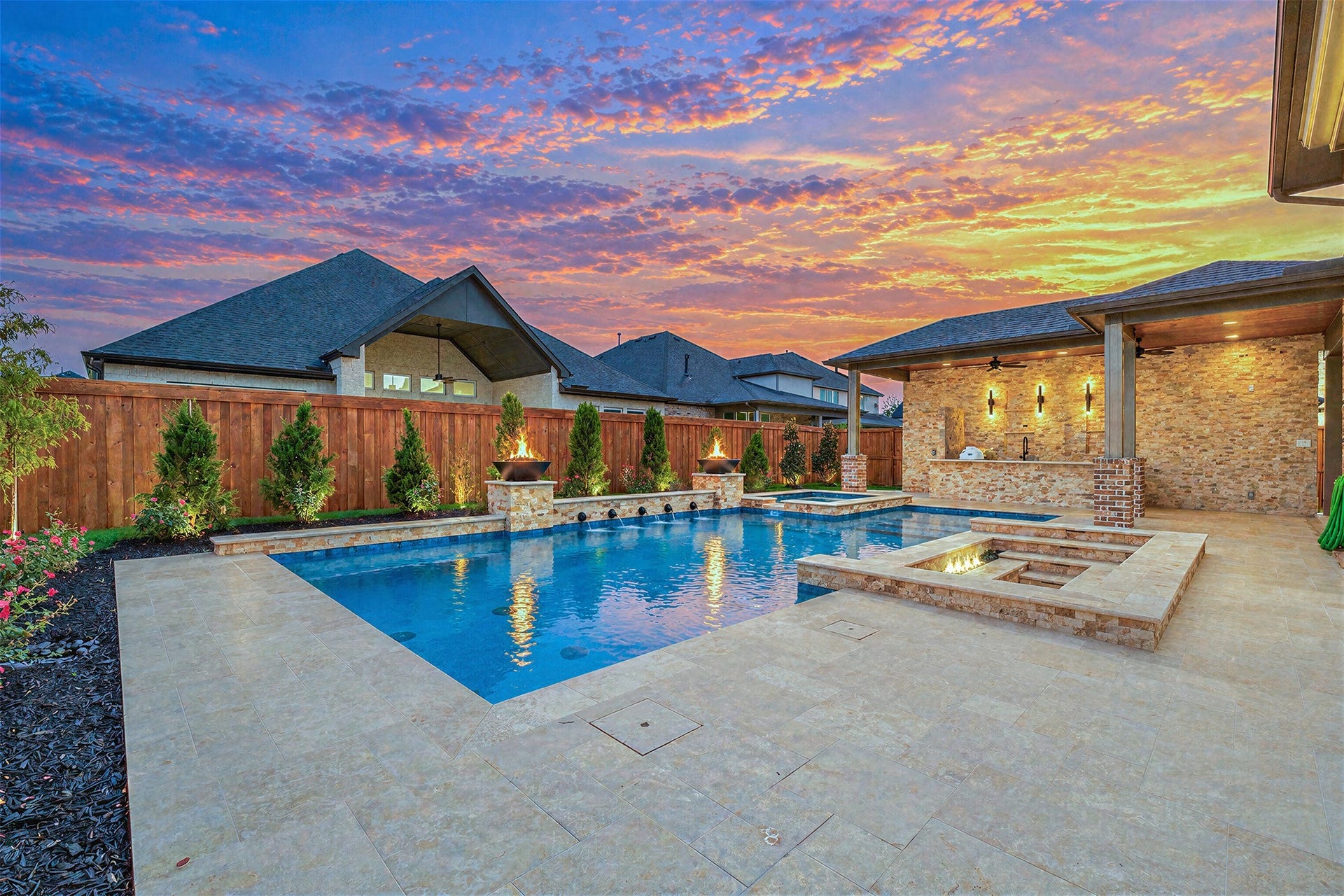 28033 Pebble Park Drive, Spring, TX 77386 Huge saltwater pool, fire bowls, sunken conversation lounge with firepit, outdoor kitchen, Travertine galore with generous spaces for lounge chairs and multiple sitting areas. Wired for outdoor sauna.