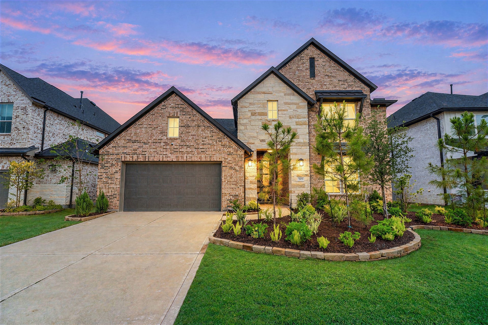 28033 Pebble Park Drive, Spring, TX 77386 New Construction in Woodson's Reserve. Completed June 2026. Gorgeous landscaping and 3 car tandem garage.