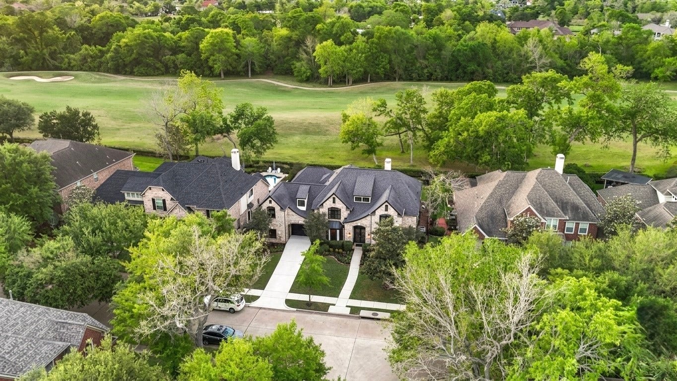 Aerial View of the front with views of the Sienna Golf Course in the rear.