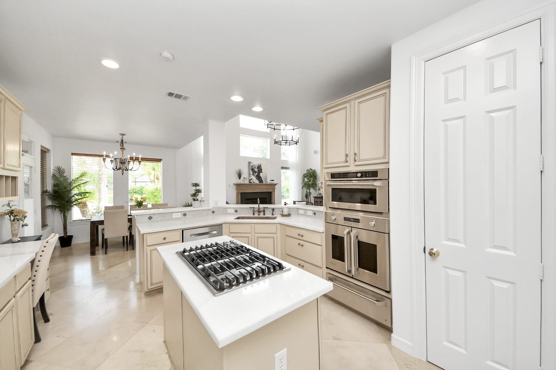 3903 Indian Point, Missouri City, TX 77459 Island kitchen with professional appliances including a french-door oven, convection oven microwave, and warming drawer