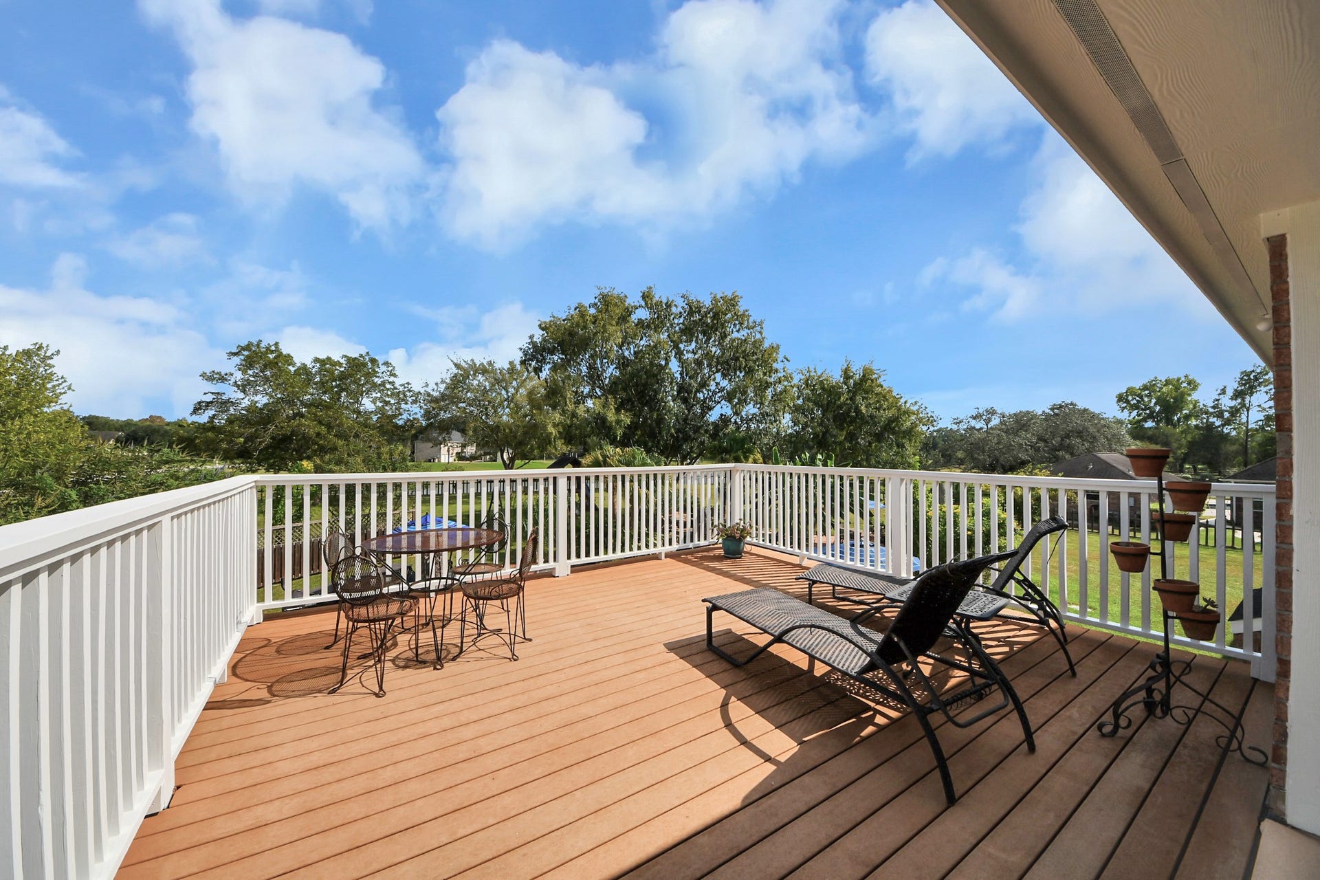 3903 Indian Point, Missouri City, TX 77459 Balcony deck off of gameroom with stairs down to the patio area and driveway below