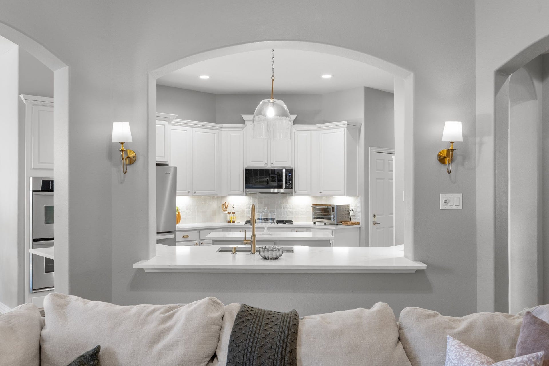 26823 Sandy Arbor Lane, Katy, TX 77494 The family room opens directly to the beautifully updated kitchen, where an expansive serving bar creates an easy connection between the two spaces.