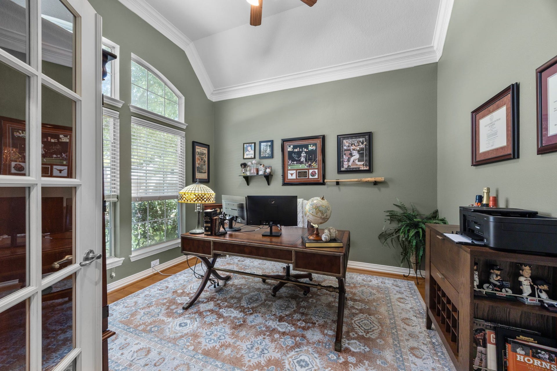 26823 Sandy Arbor Lane, Katy, TX 77494 Private study features French doors, hardwood flooring, high ceiling with crown molding and tall arched windows overlooking the front yard.