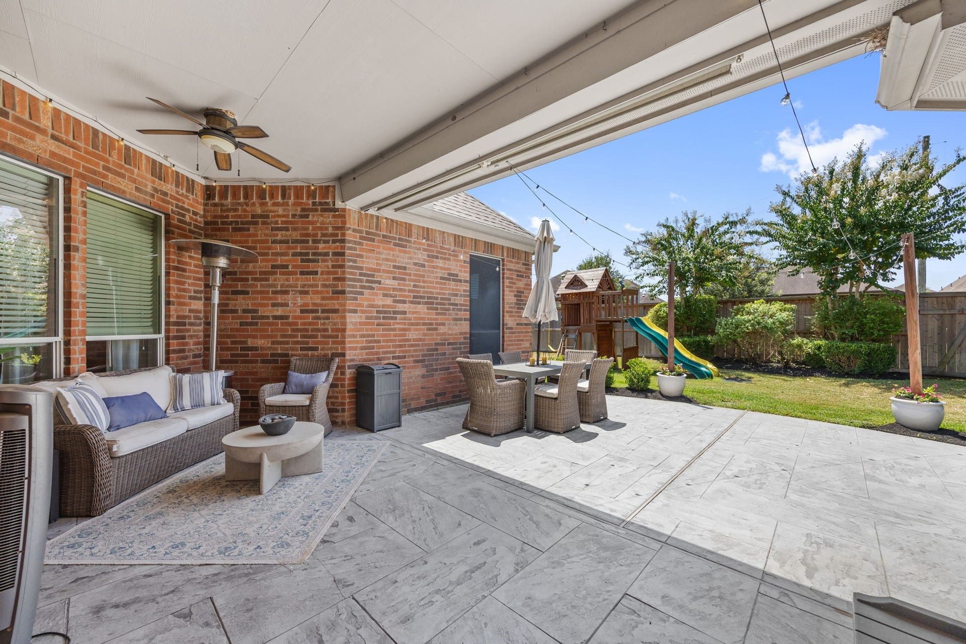 26823 Sandy Arbor Lane, Katy, TX 77494 Stamped-concrete patio creates an impressive, upscale outdoor entertaining space.