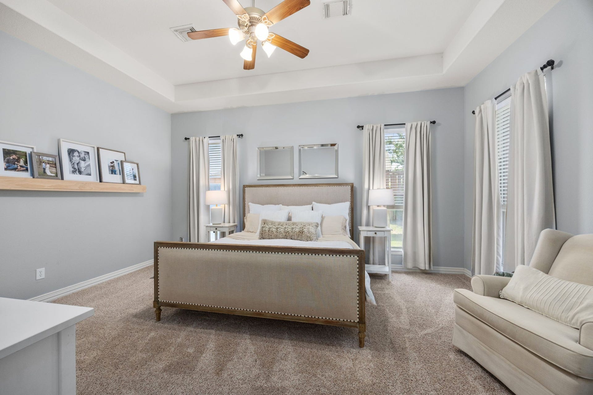 26823 Sandy Arbor Lane, Katy, TX 77494 Spacious primary suite features a tray ceiling, multiple tall windows and ample room for a sitting area, creating a comfortable private retreat.