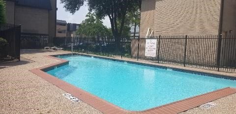 8433 Hearth Drive, #38, Houston, TX 77054 Relax with the kids at the swimming pool.