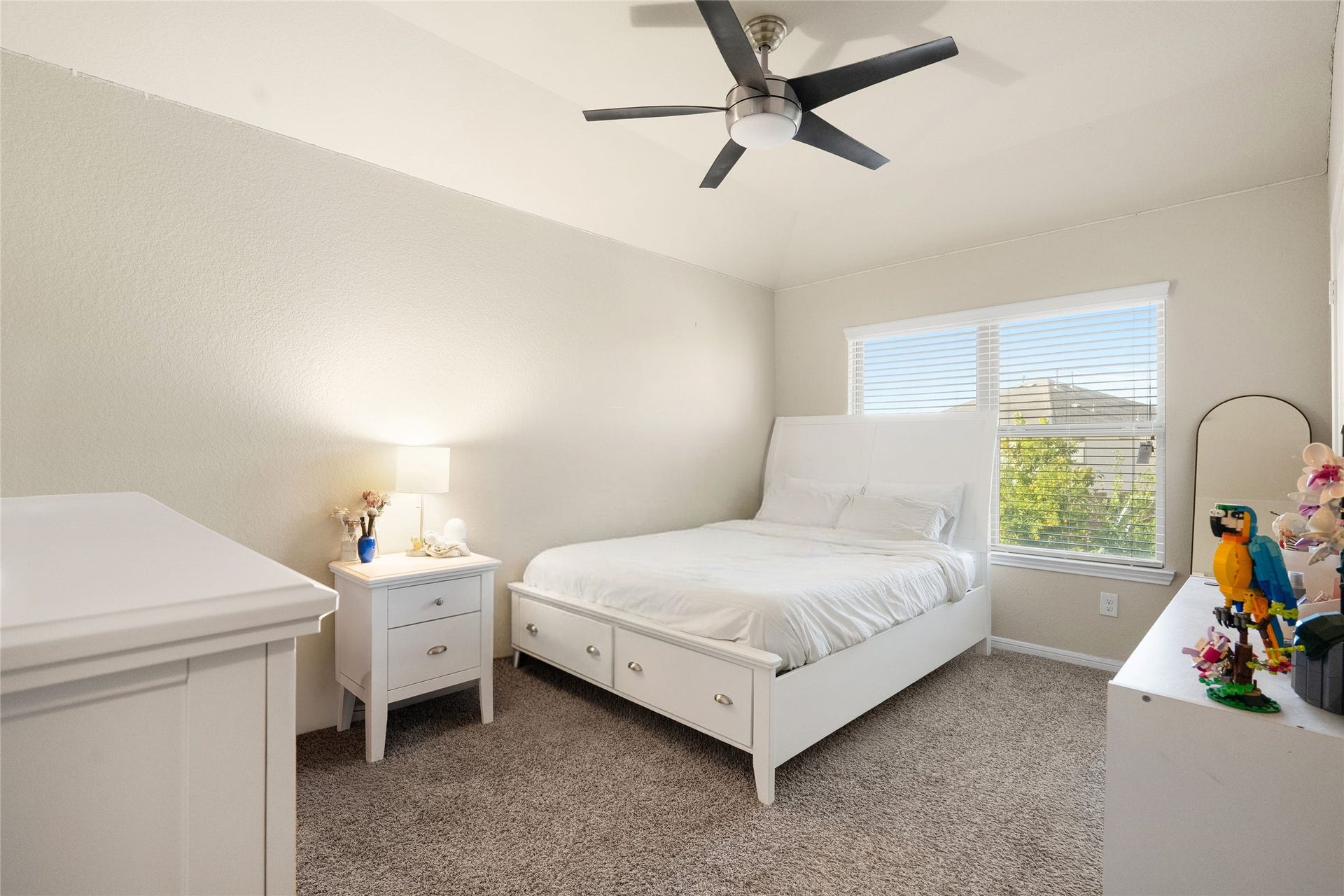 3650 Daintree Park Drive, Katy, TX 77494 Bright and inviting bedroom with a vaulted ceiling, modern ceiling fan, and large window offering plenty of natural light.