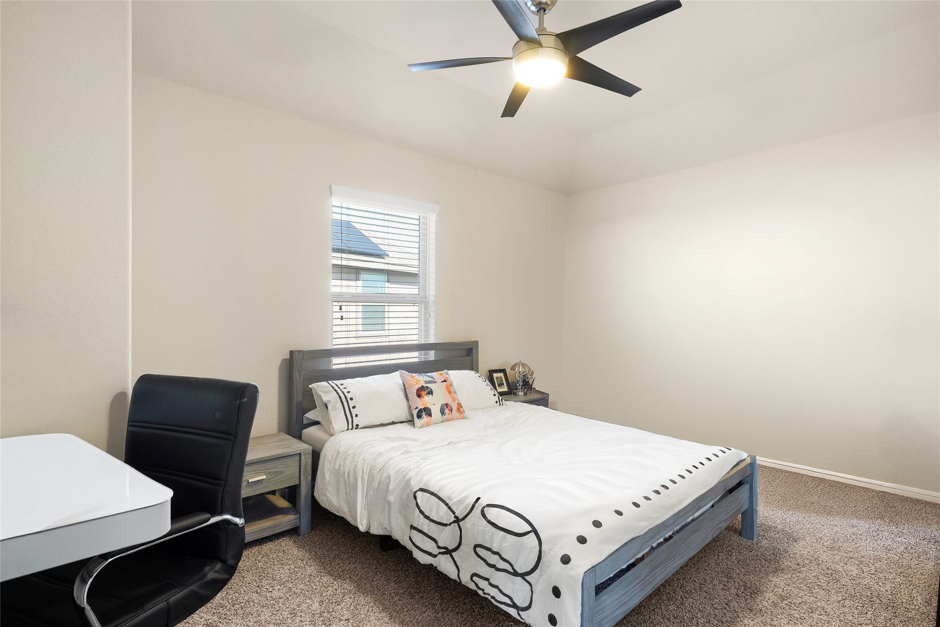3650 Daintree Park Drive, Katy, TX 77494 Cozy bedroom with neutral tones features a modern ceiling fan, plush carpeting, and ample natural light through a well-placed window.