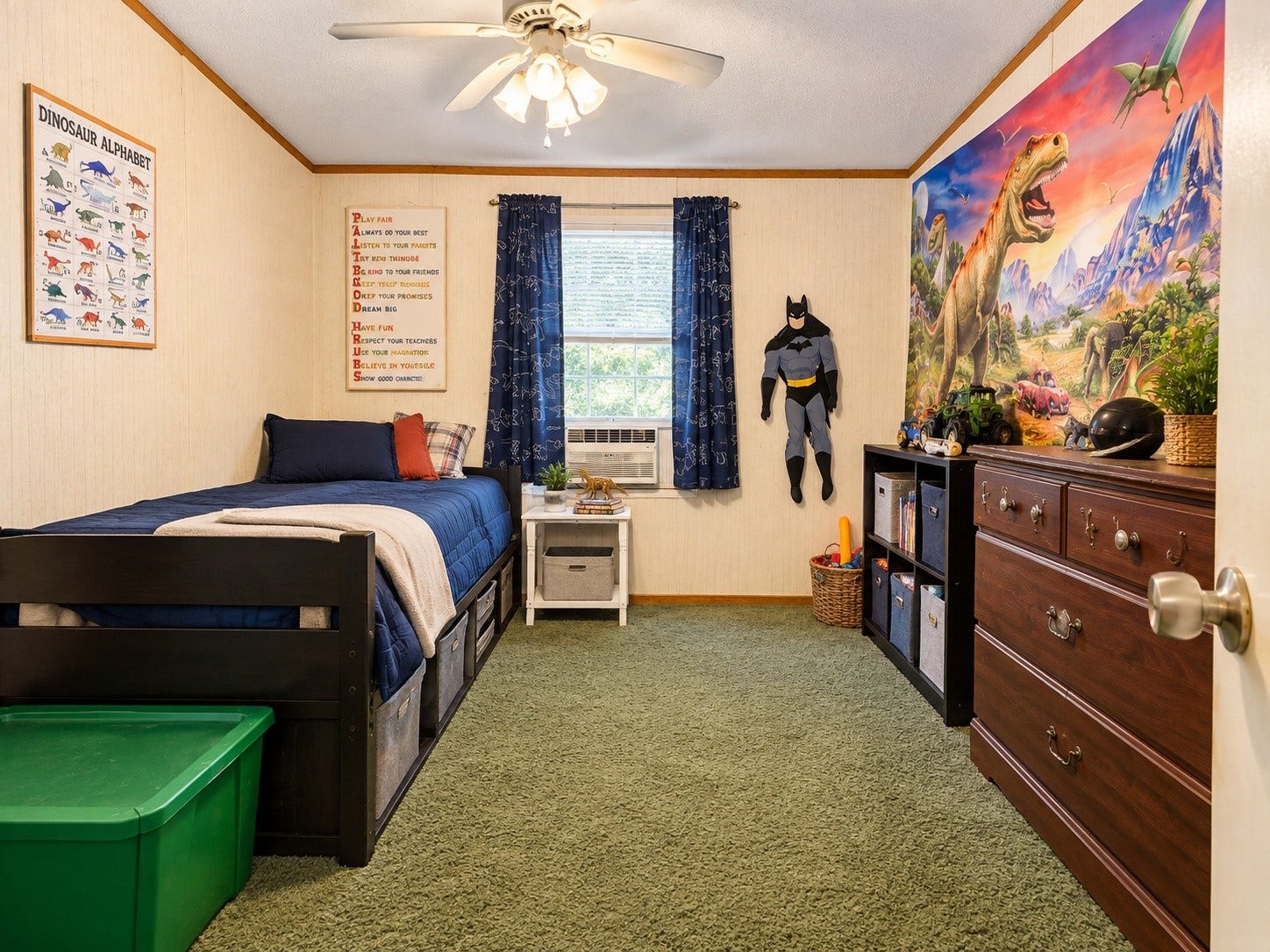 Virtually Edited  Bedroom: Spacious secondary bedroom featuring a ceiling fan, window for natural light, and ample room for bedroom furniture and storage.
