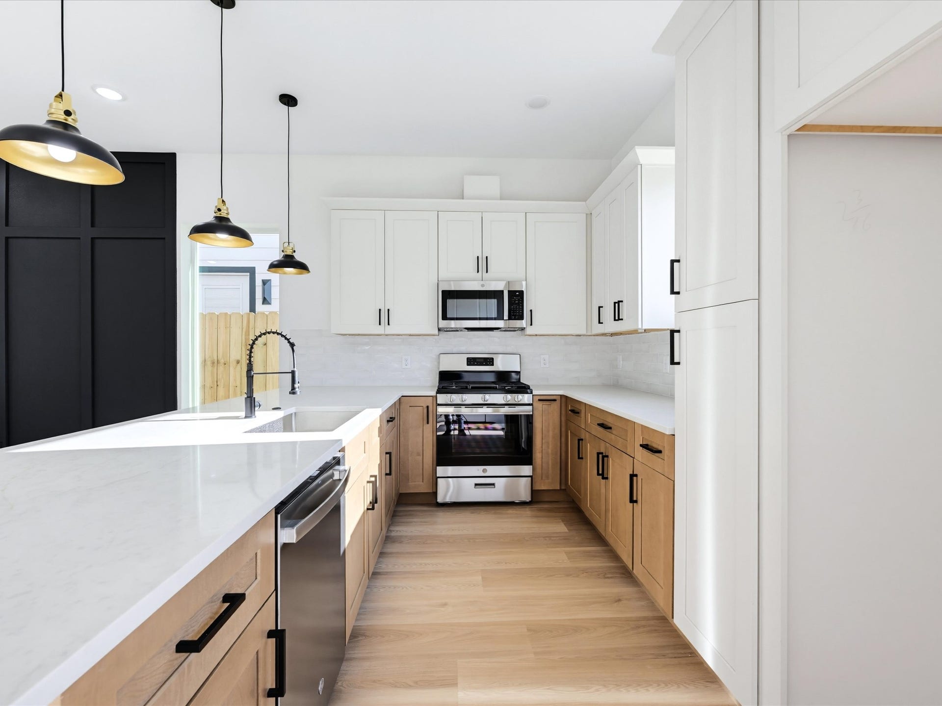 9119 Henrietta Street, #A/B, Houston, TX 77088 A full suite of stainless steel appliances is complemented by a timeless tile backsplash
and ample countertop workspace.
