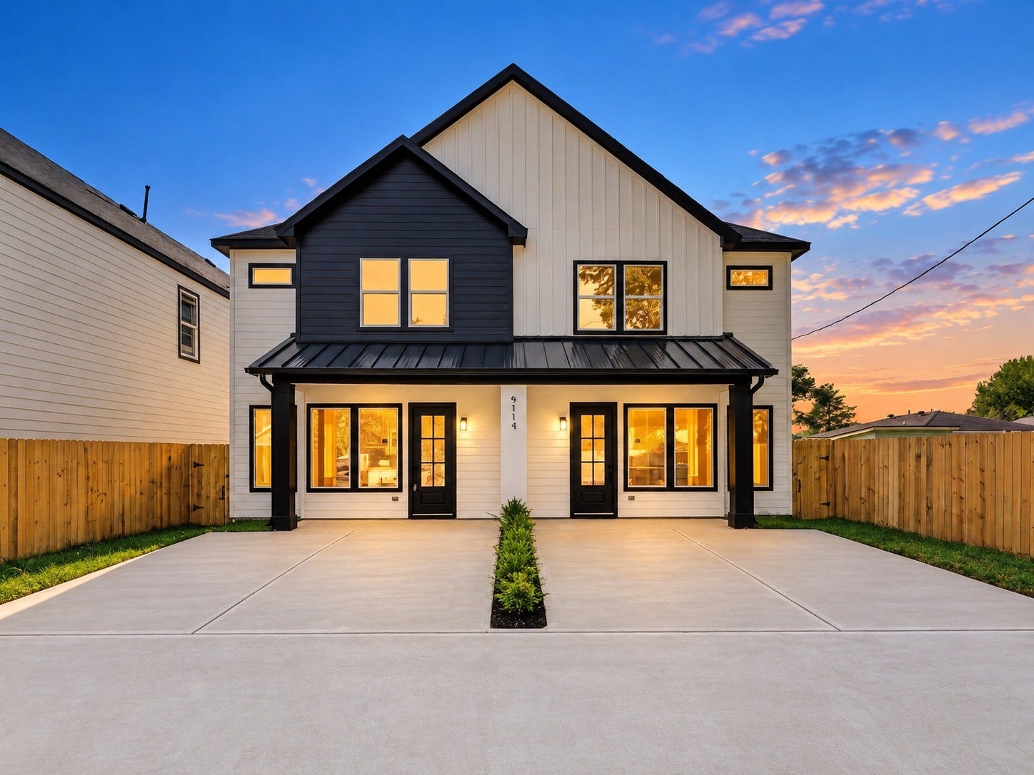 9119 Henrietta Street, #A/B, Houston, TX 77088 Twilight Photo highlights the modern farmhouse design and curb appeal.